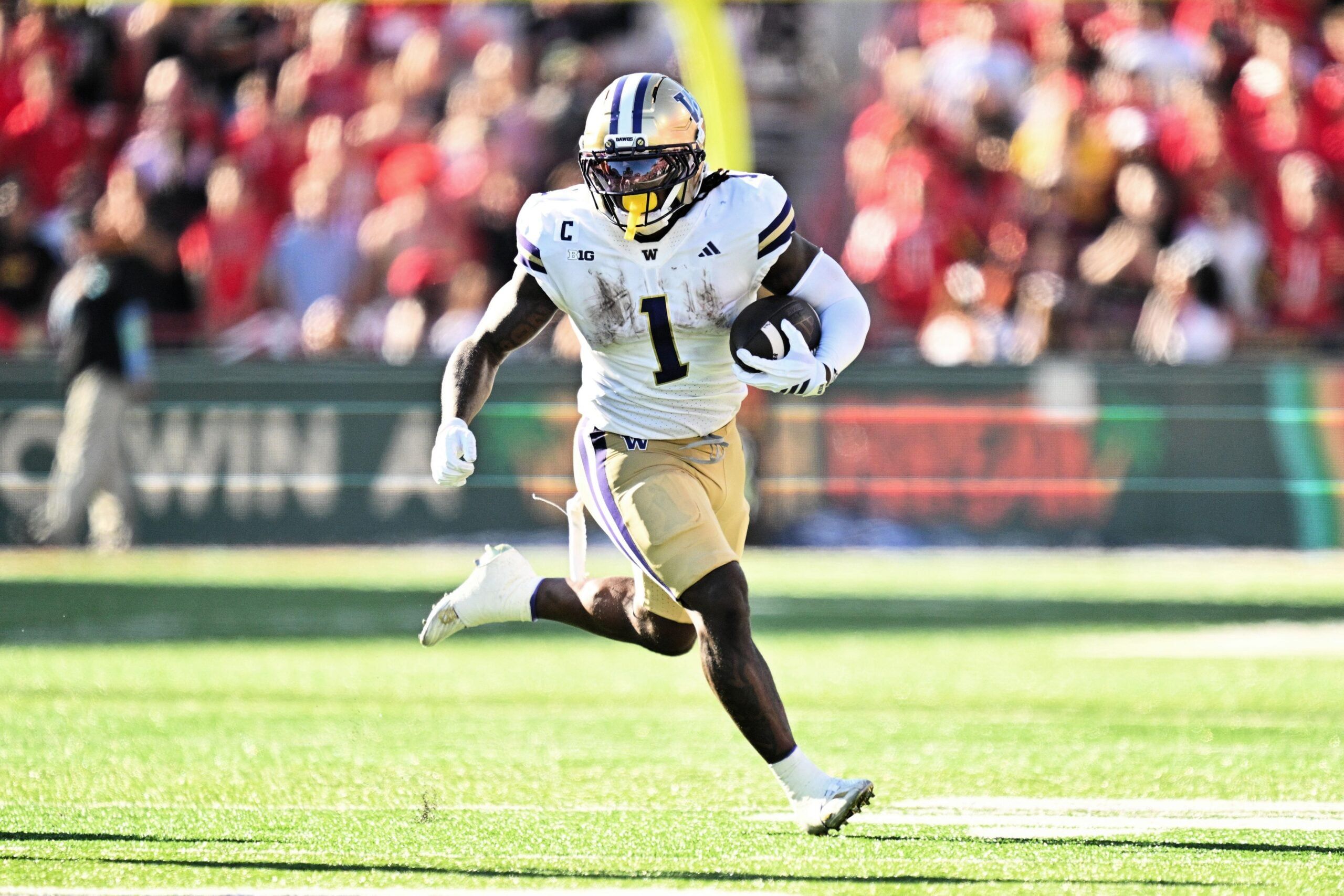 Jonah Coleman runs with the ball during a game against the Maryland Terrapins.
