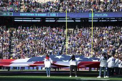 Fans at Giants-Vikings game and flag in 2025