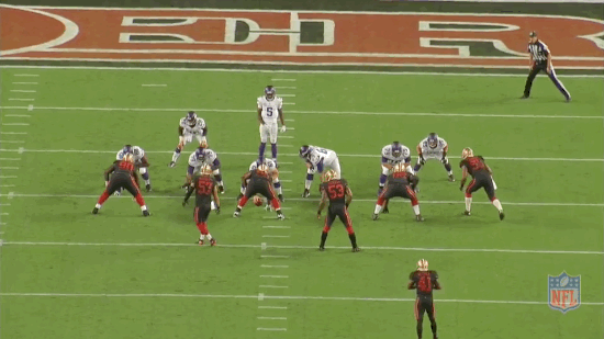 Adrian Peterson is stopped for a one-yard gain after bouncing the play outside