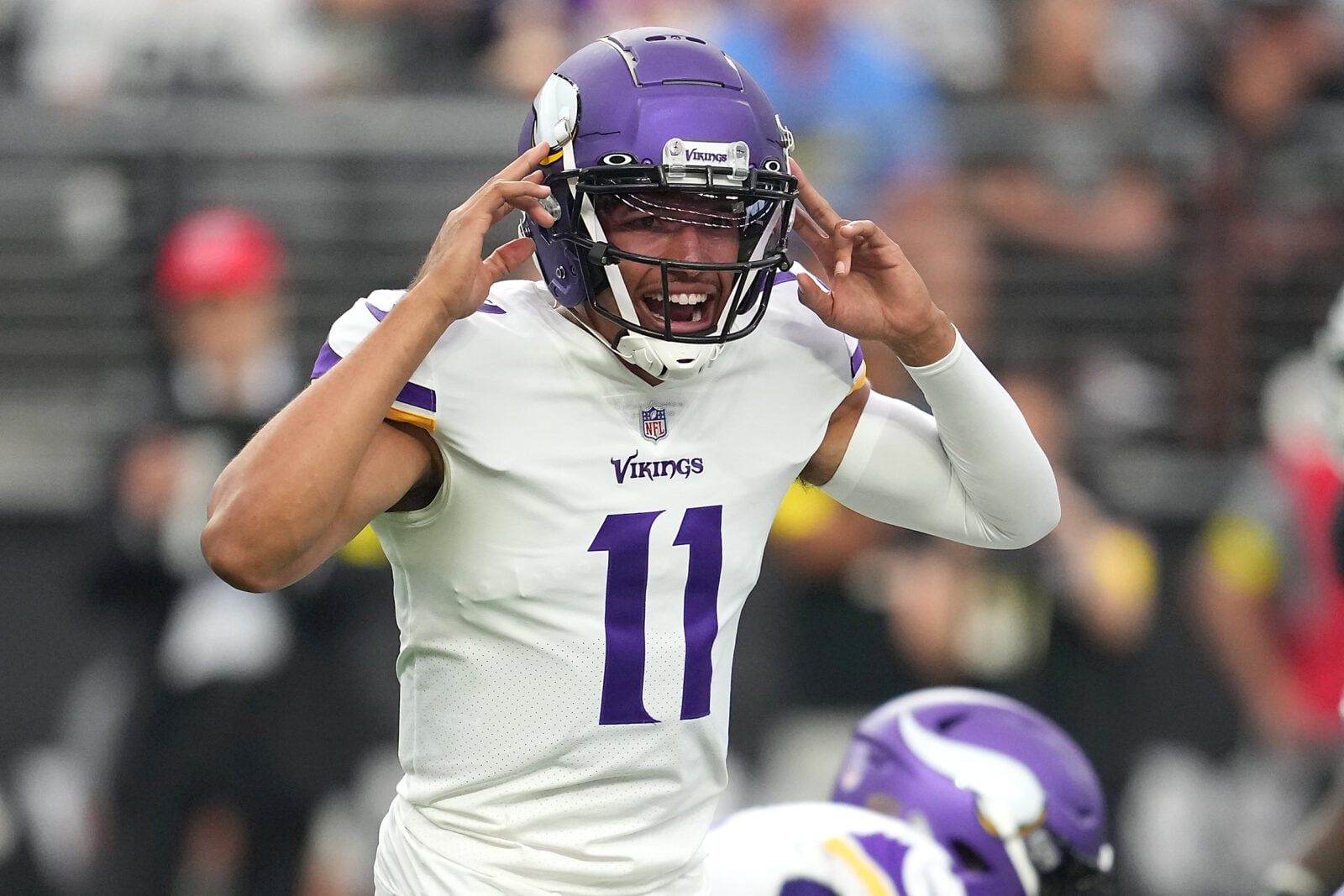 Kellen Mond calls out a play at the line during a Vikings preseason game.