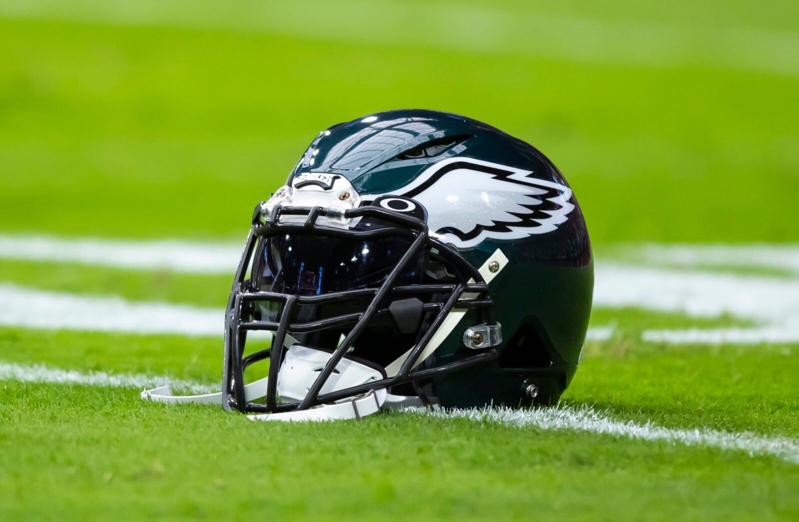 Close-up view of a Philadelphia Eagles helmet on the sideline at State Farm Stadium in Glendale.