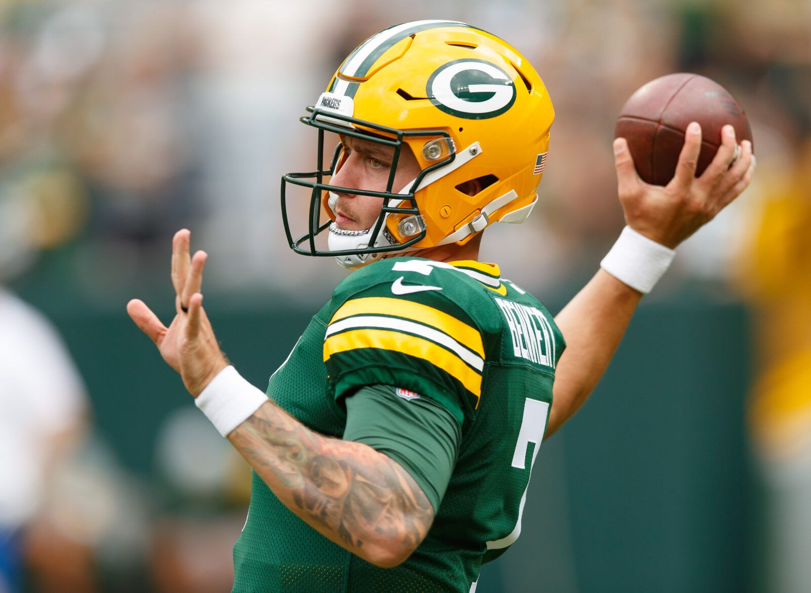 Kurt Benkert stands in uniform during a Packers preseason game.