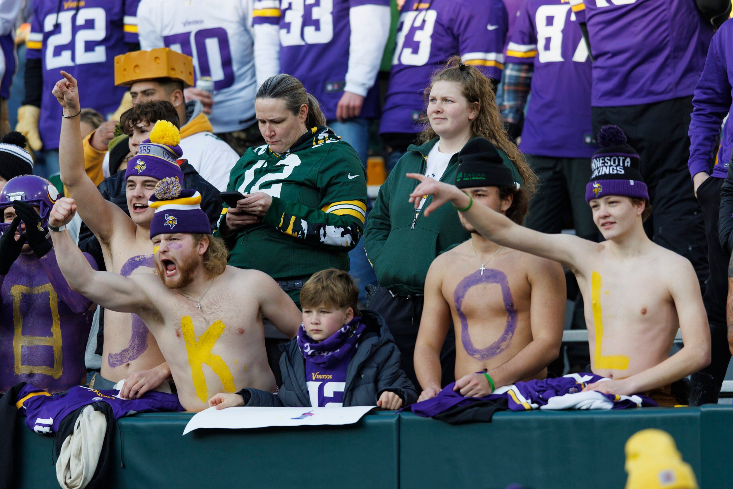 Minnesota Vikings fans cheer in the stands at Lambeau Field before a matchup with the Green Bay Packers on January 1, 2023.