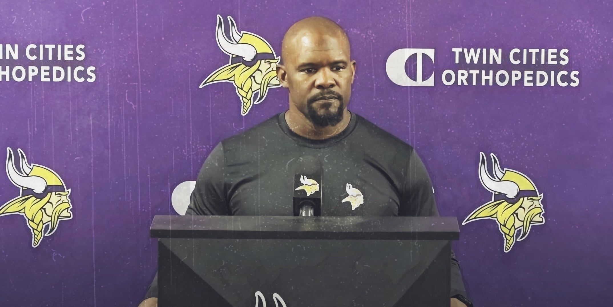 Brian Flores speaks to reporters at the Vikings’ TCO Performance Center.