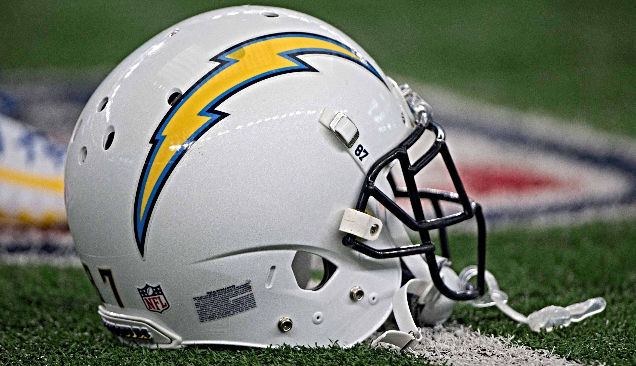 A Los Angeles Chargers helmet sits on the sideline before the team’s Thanksgiving Day win over the Cowboys at AT&T Stadium.