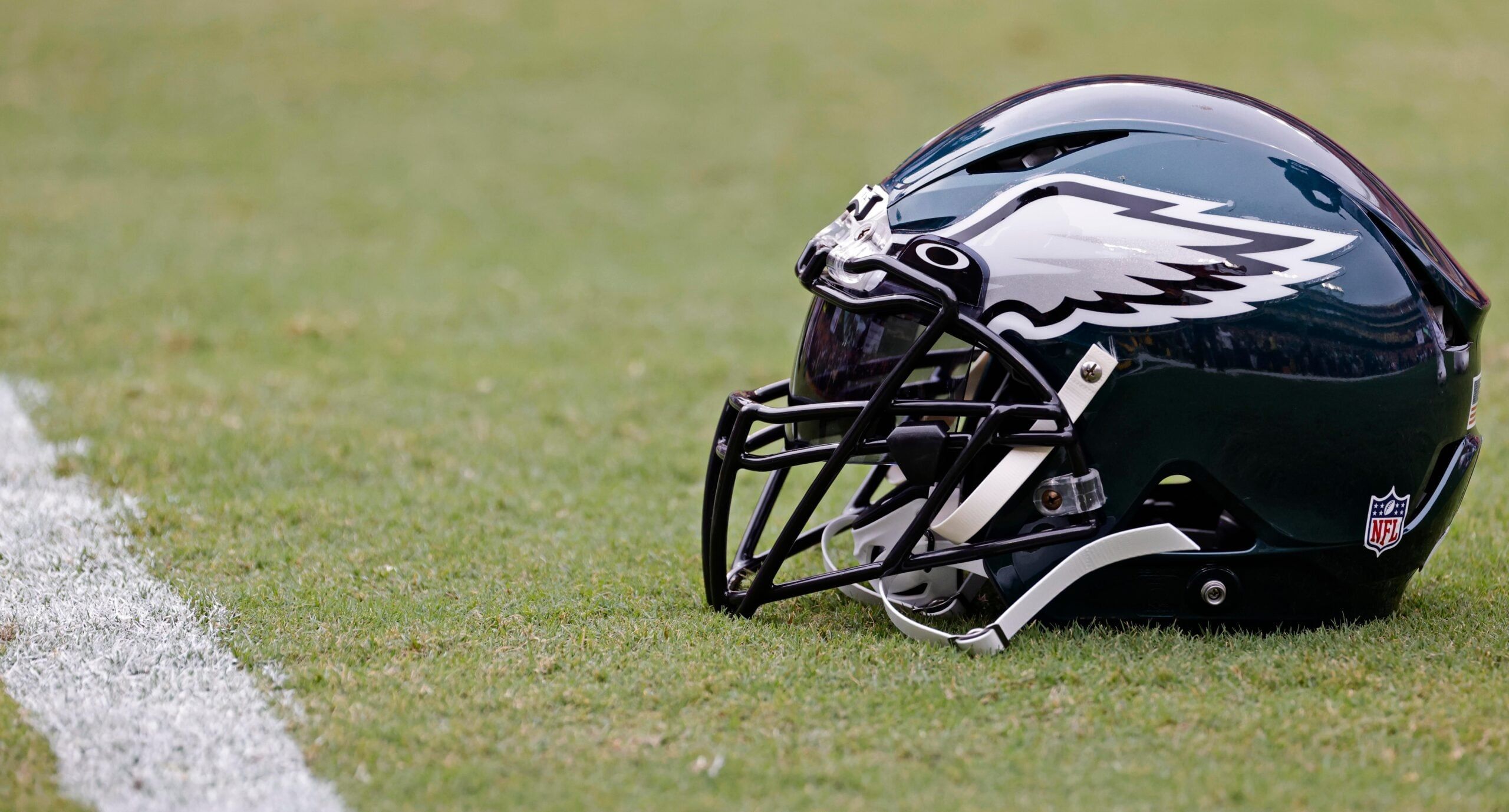 Philadelphia Eagles helmet resting on the field before a game