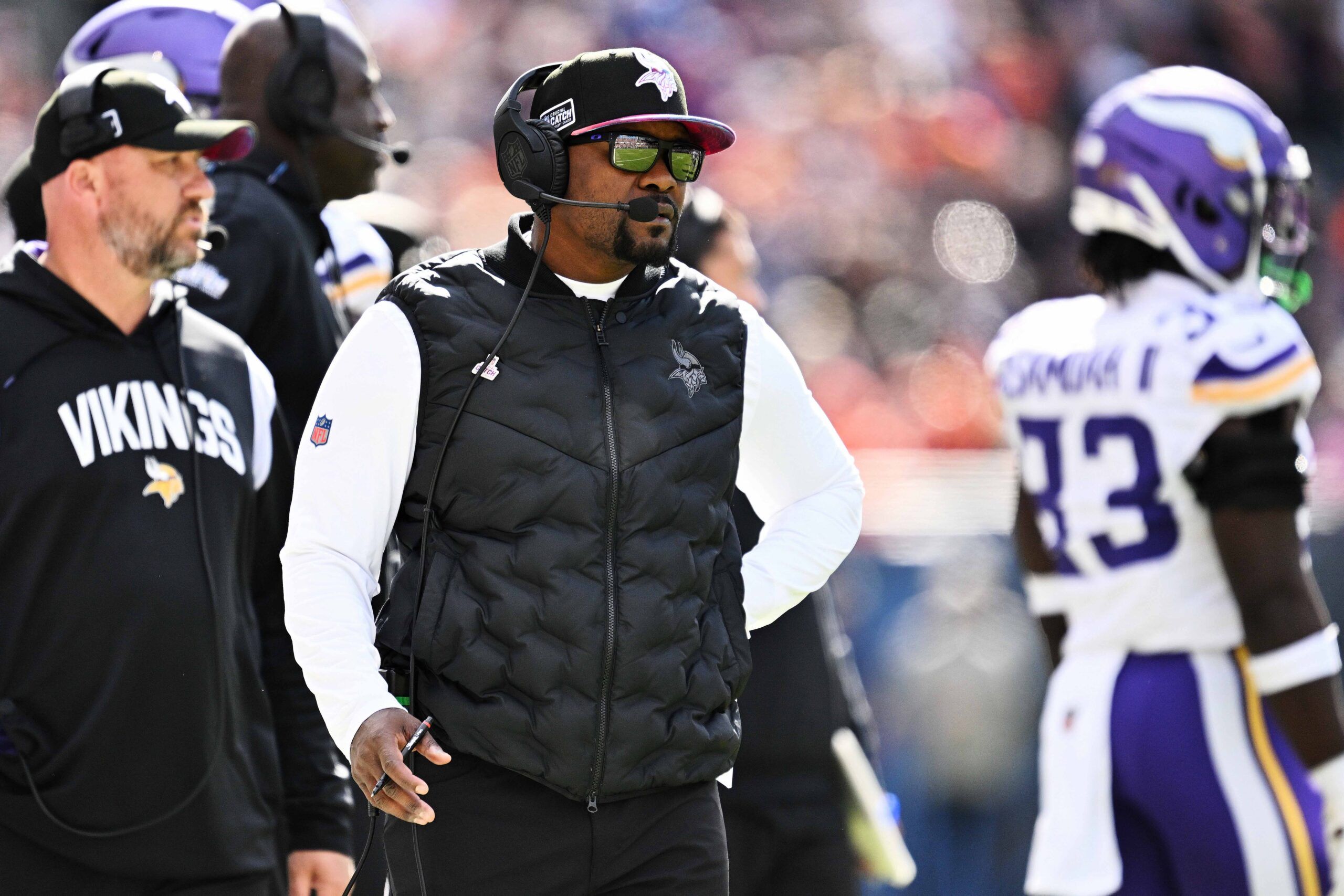 Brian Flores watches from the sideline during Vikings-Bears game at Soldier Field.