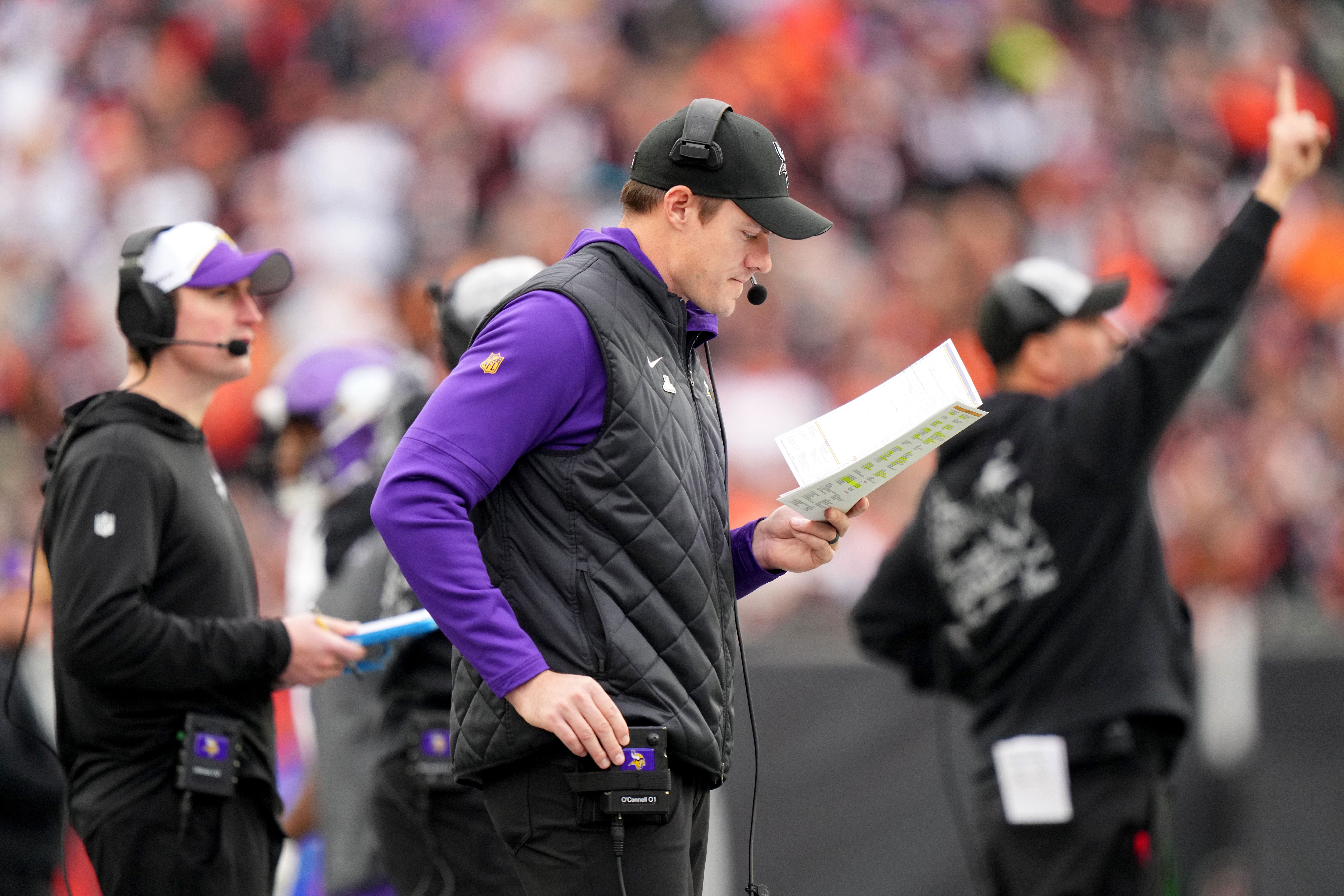 Vikings head coach Kevin O'Connell signals a play from the sideline during a game against the Cincinnati Bengals at Paycor Stadium.