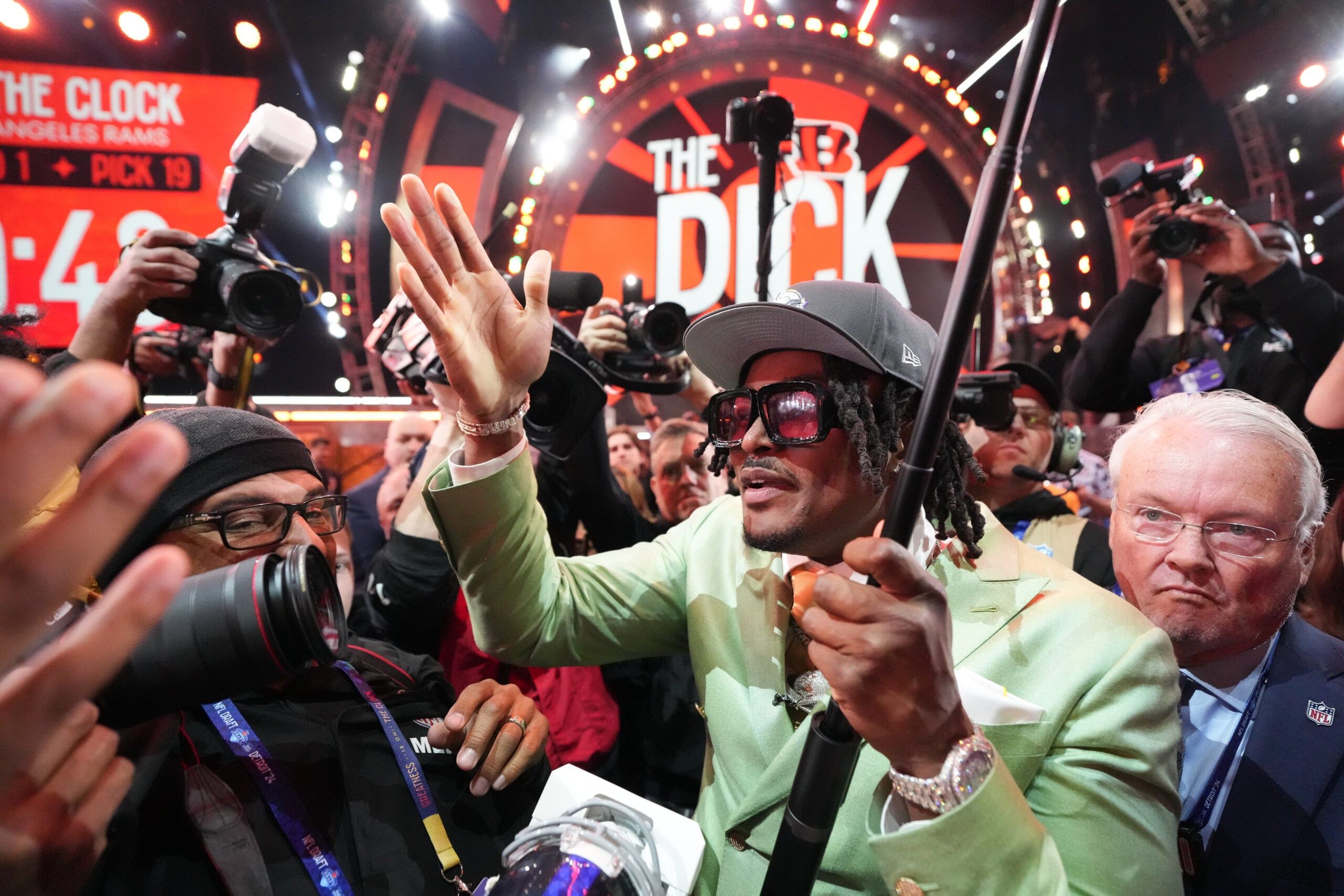 Dallas Turner poses with fans after being drafted by the Vikings