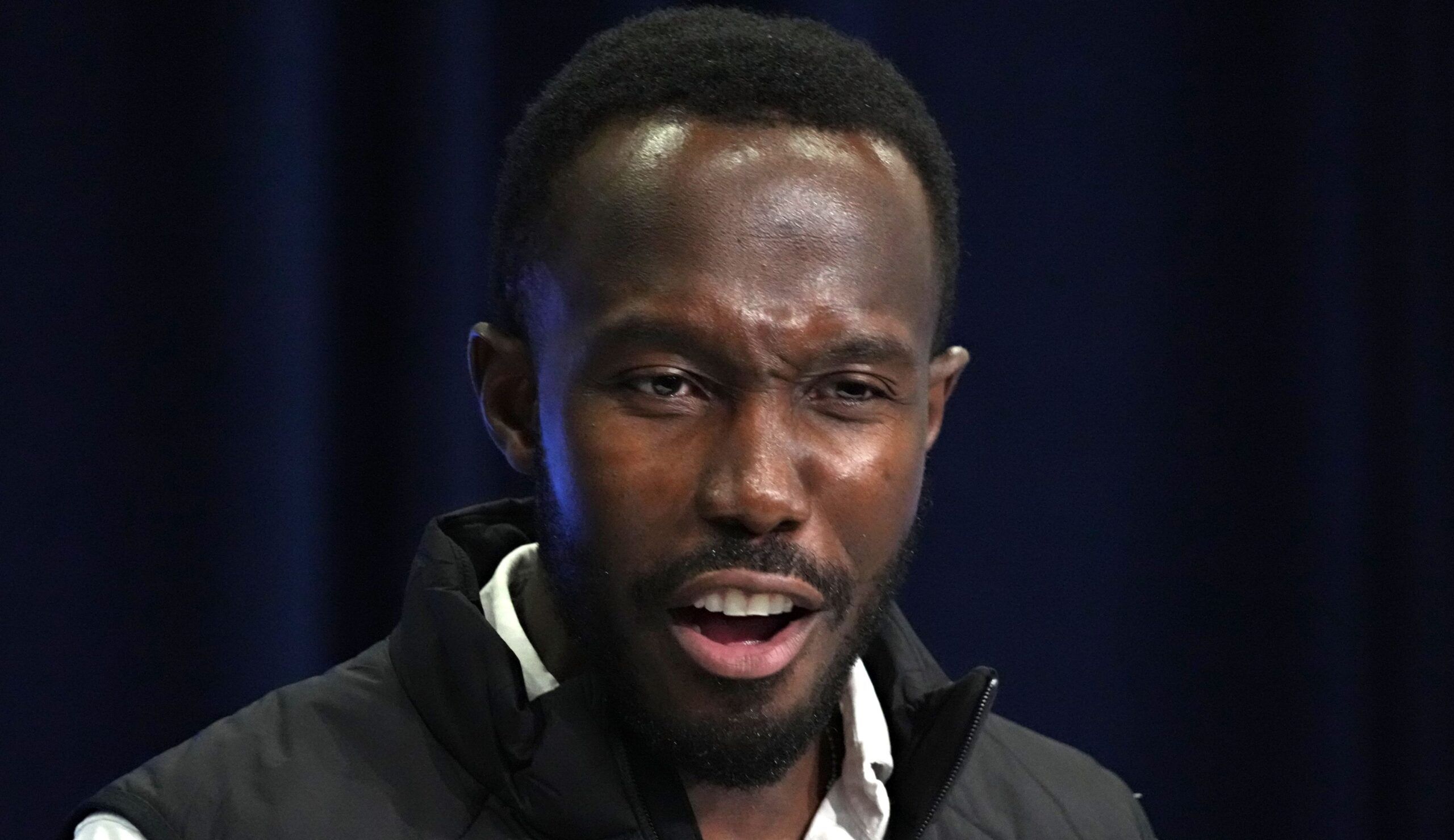 Kwesi Adofo-Mensah speaks at his podium during the 2024 NFL Scouting Combine.