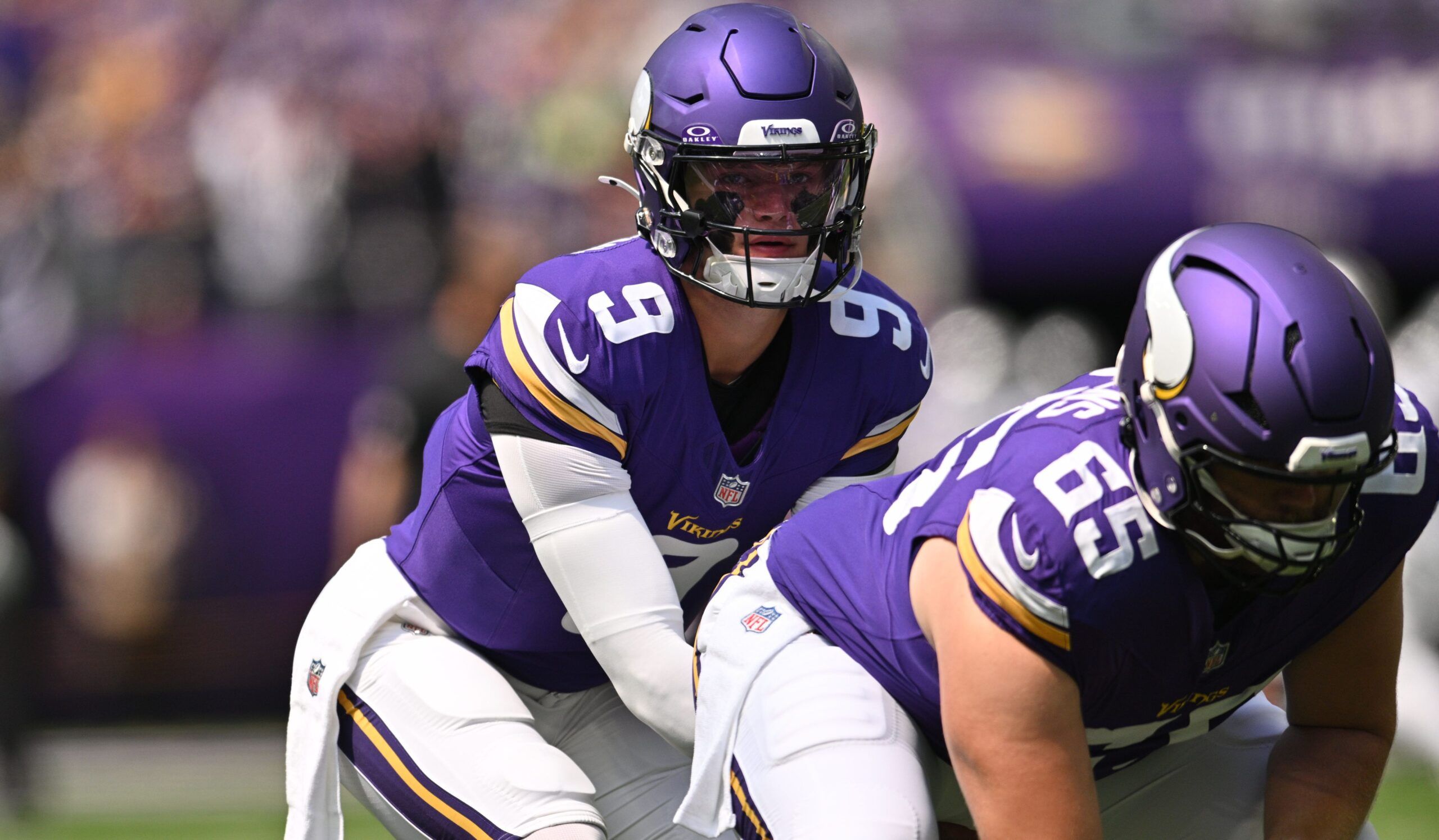 J.J. McCarthy and Michael Jurgens warm up before facing the Raiders at U.S. Bank Stadium.