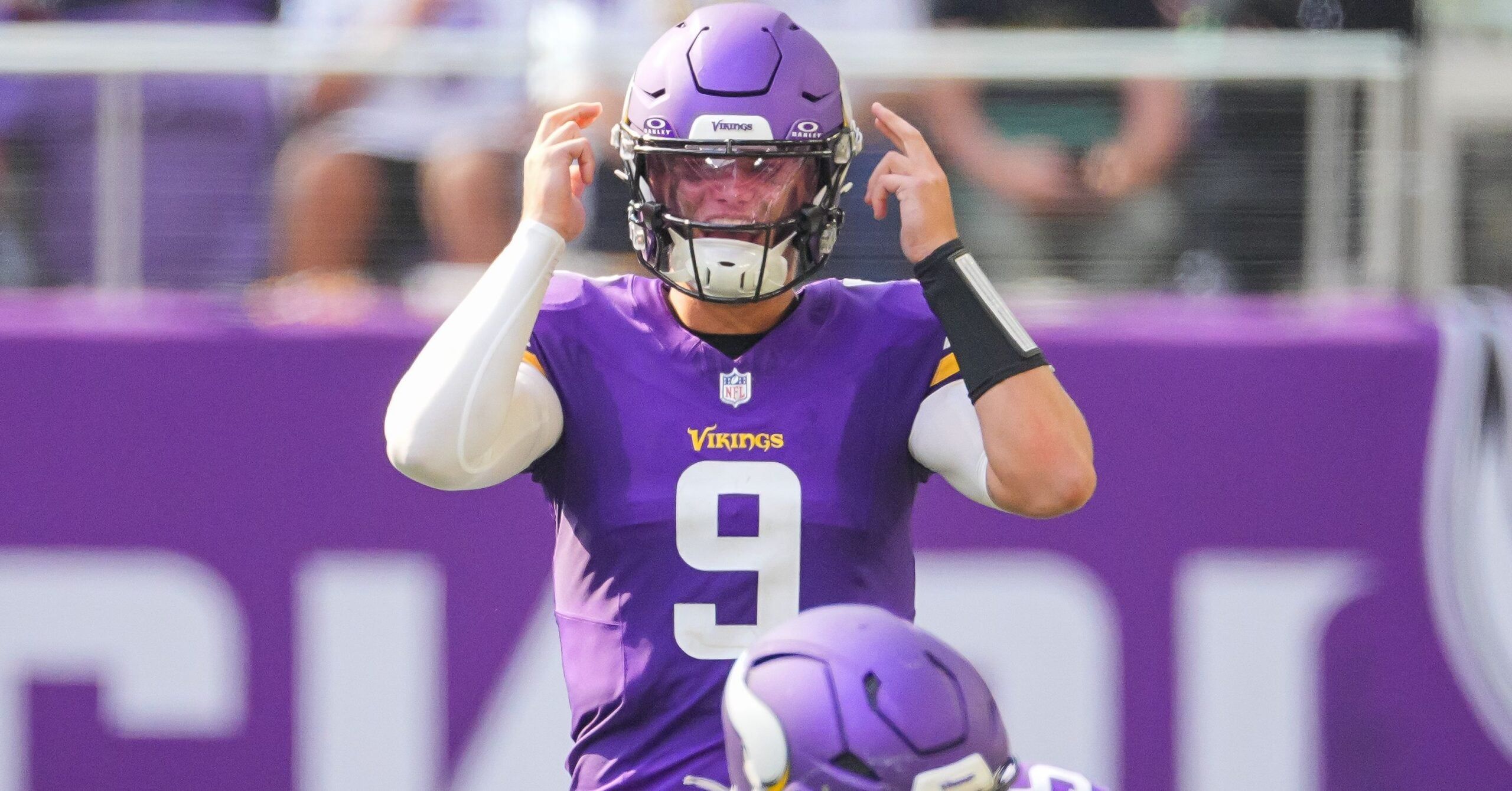 J.J. McCarthy lines up under center during a preseason game against the Las Vegas Raiders.