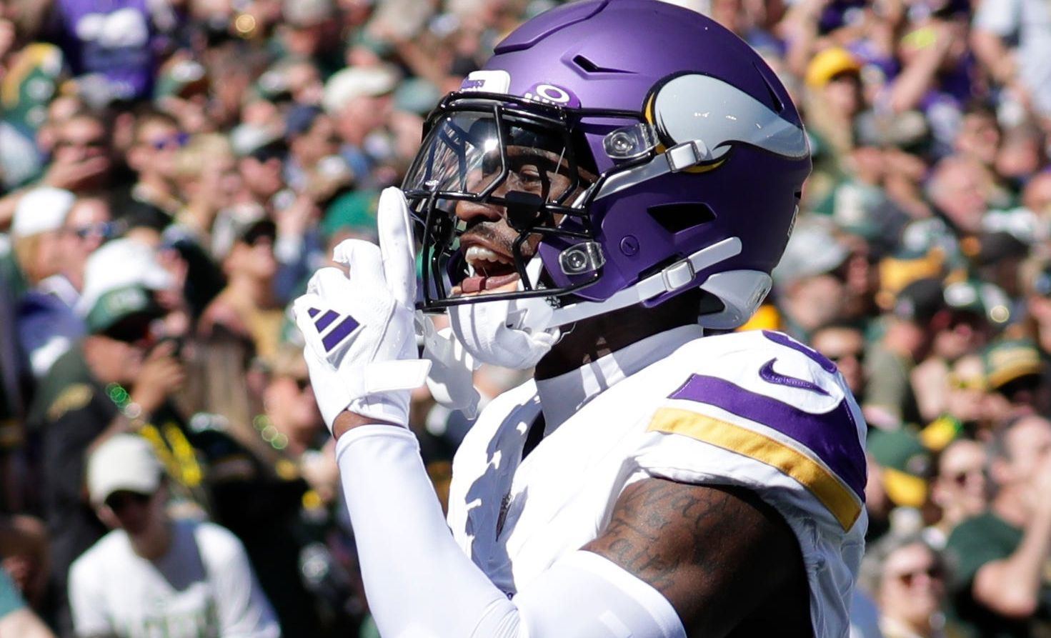 Jordan Addison celebrates after scoring a touchdown against the Packers at Lambeau Field.