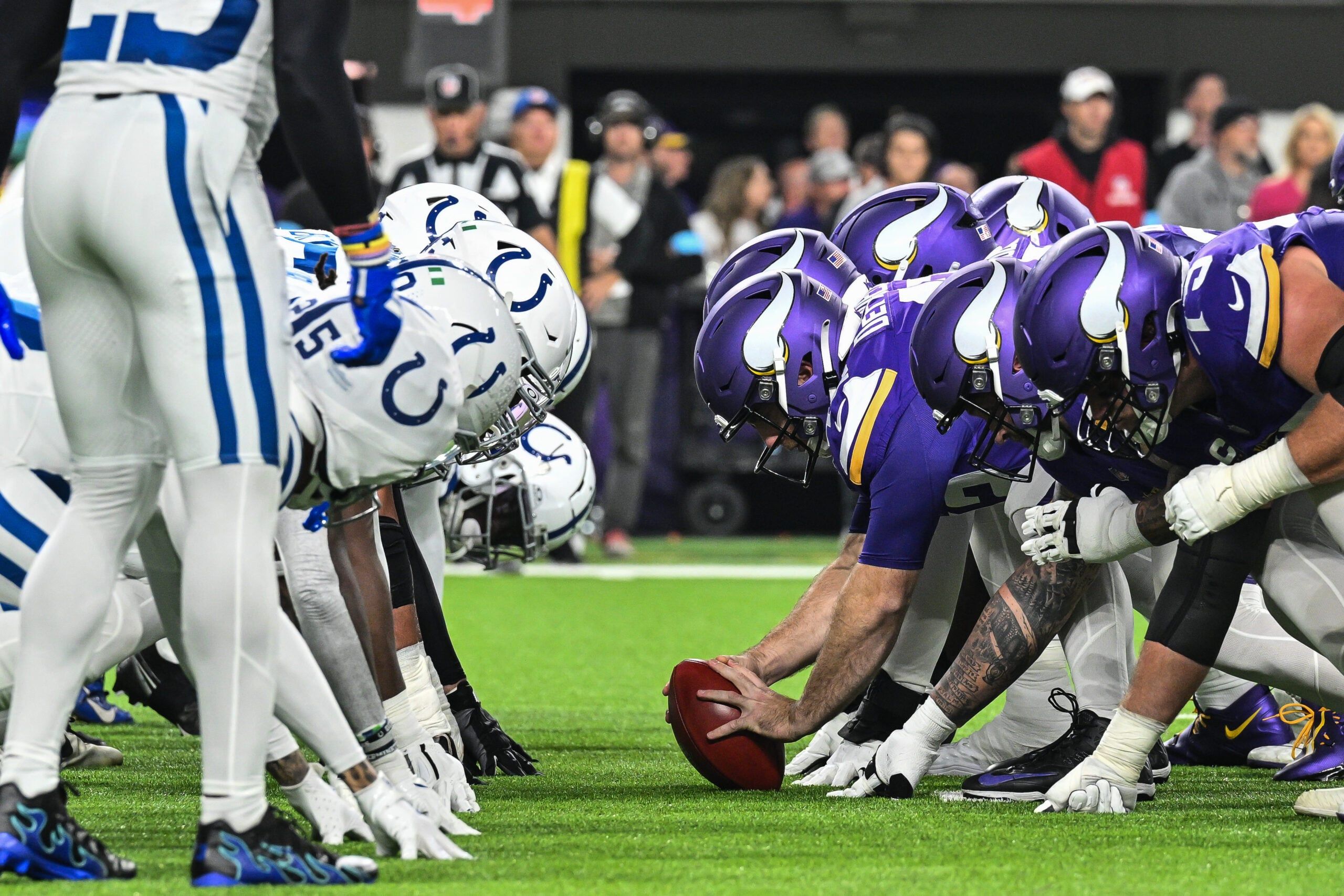 Vikings and Colts linemen collide at the line of scrimmage during a game at U.S. Bank Stadium.