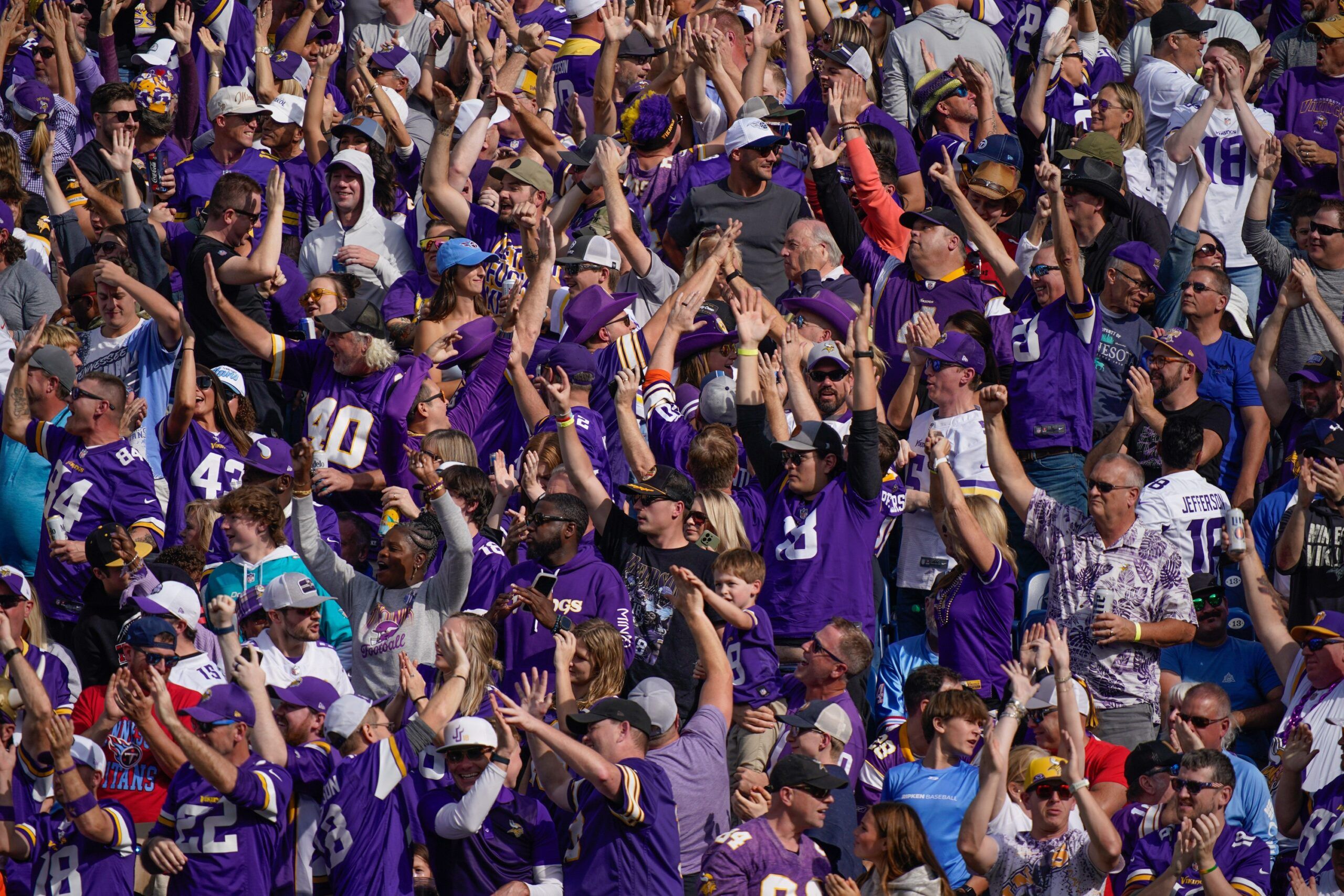 Vikings fans celebrate a Jordan Addison touchdown during a road game at Nissan Stadium in Nashville.