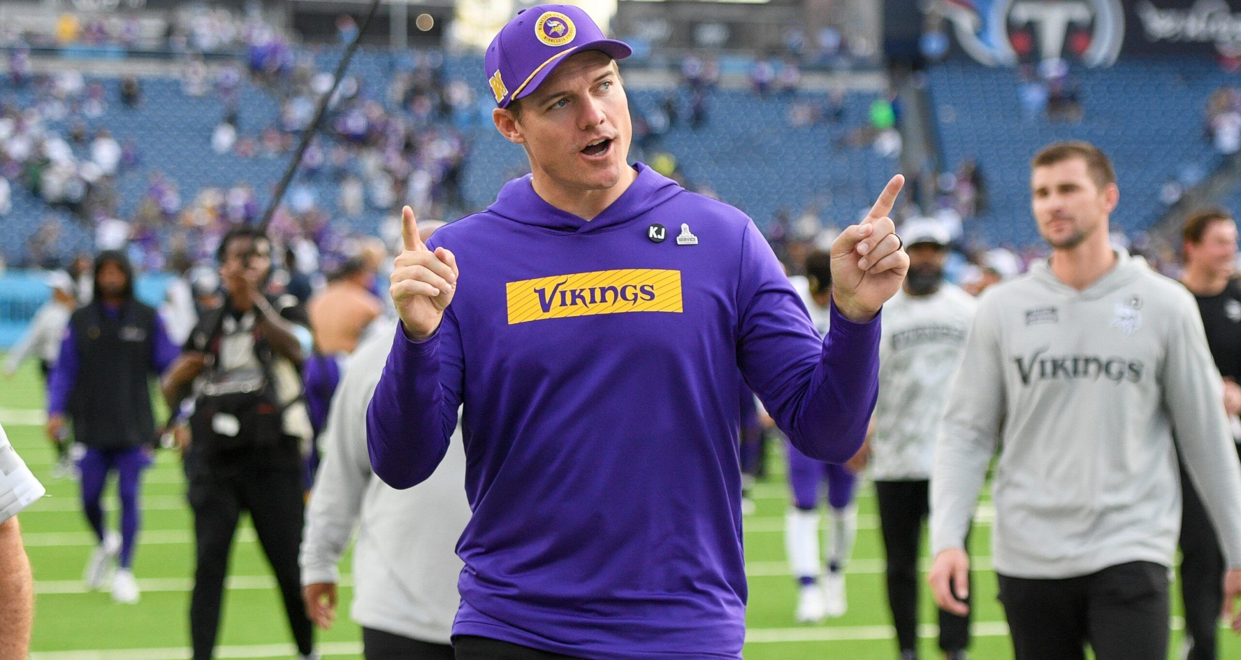 Vikings head coach Kevin O’Connell points to fans while exiting the field against the Titans.
