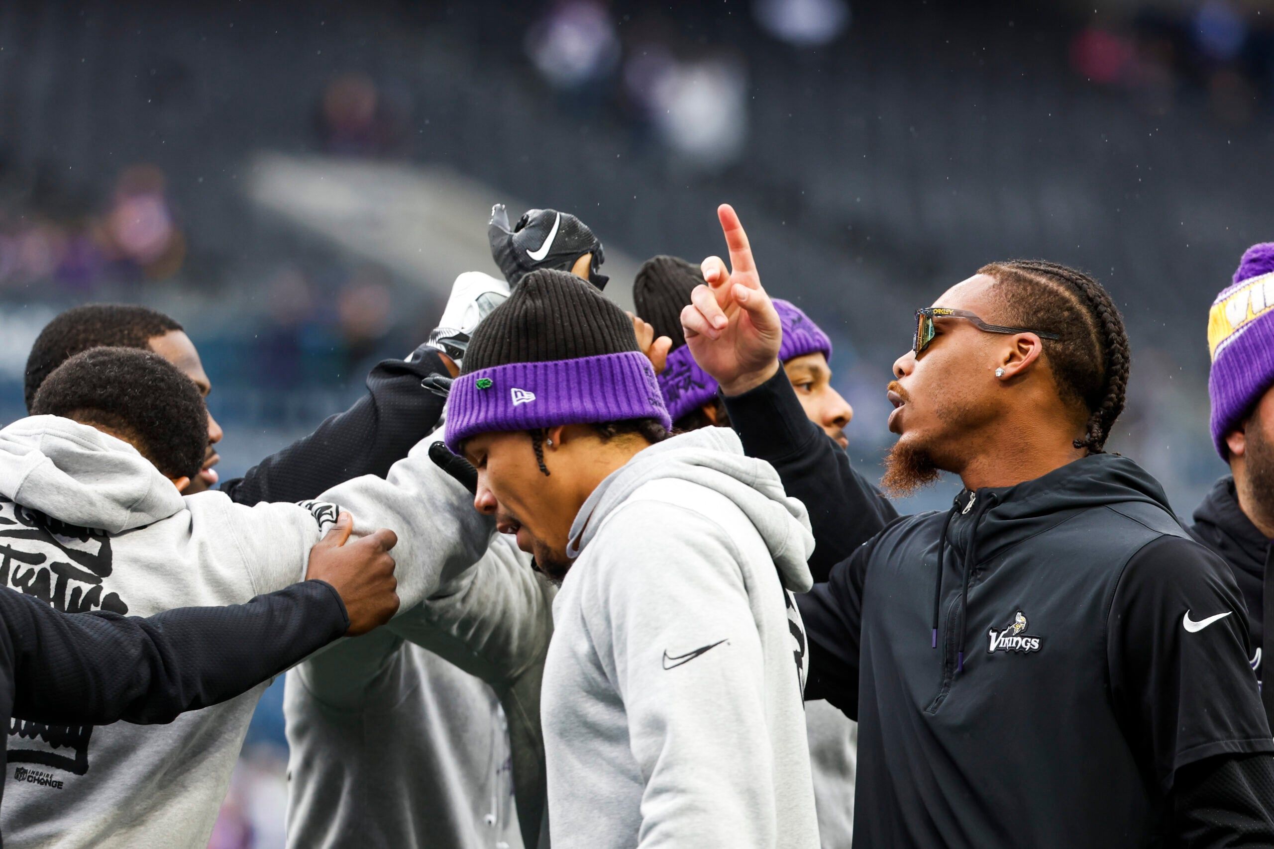 Justin Jefferson huddles with teammates before the game in Seattle.
