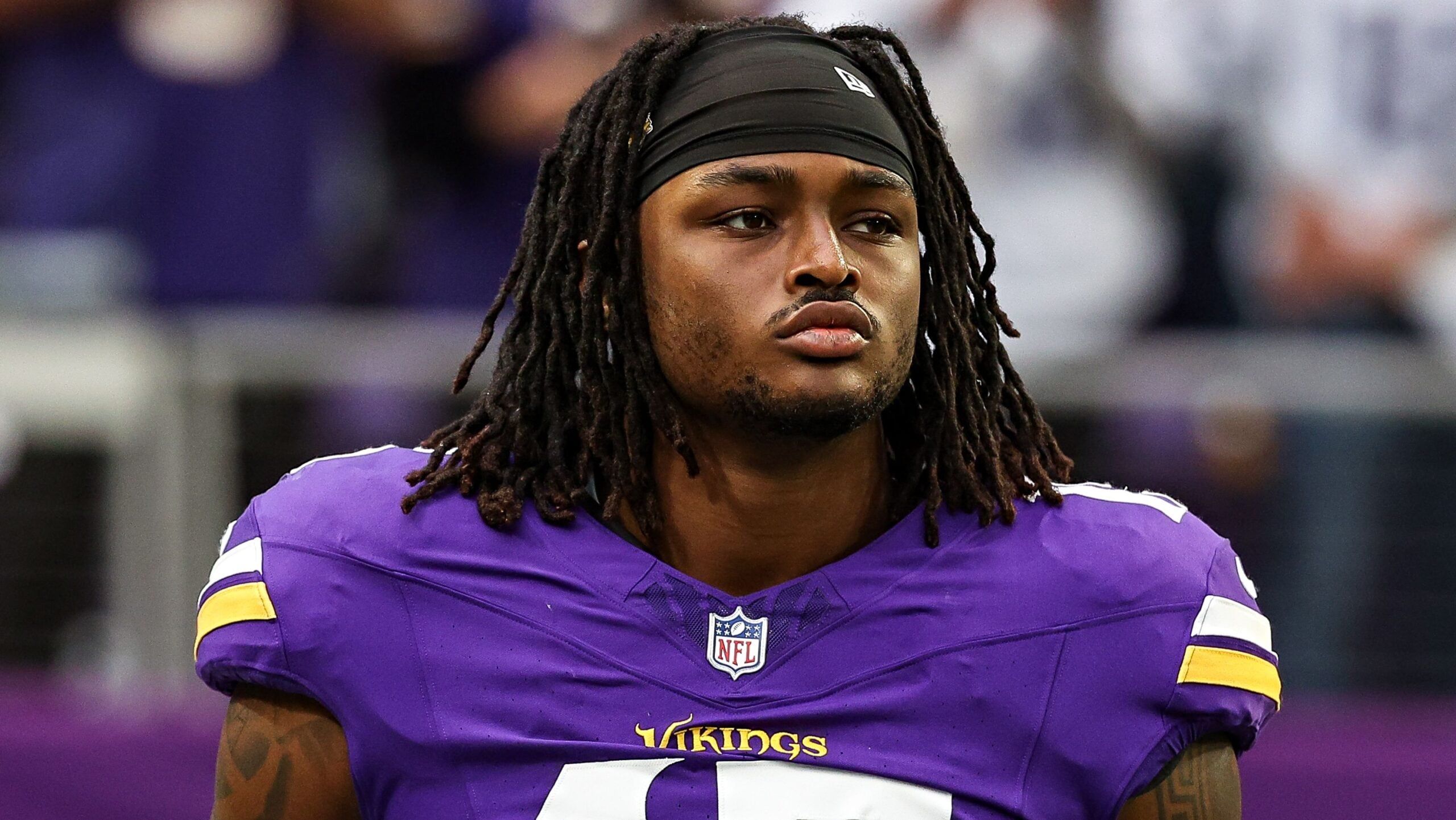 Dallas Turner stands on the sideline before a Vikings game against the Falcons at U.S. Bank Stadium.