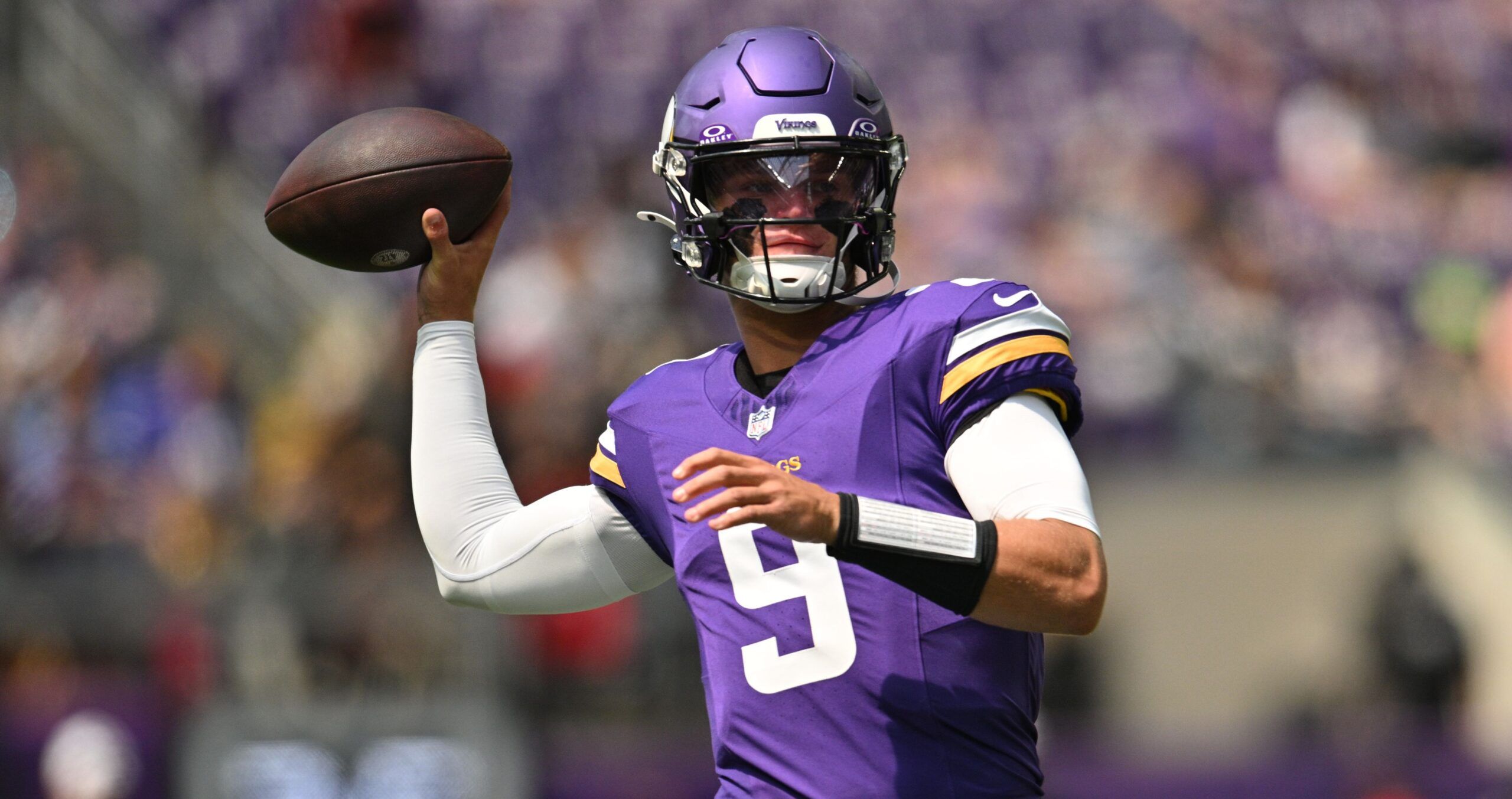 J.J. McCarthy throws during pregame warm-ups before the Vikings-Raiders game in Minneapolis.