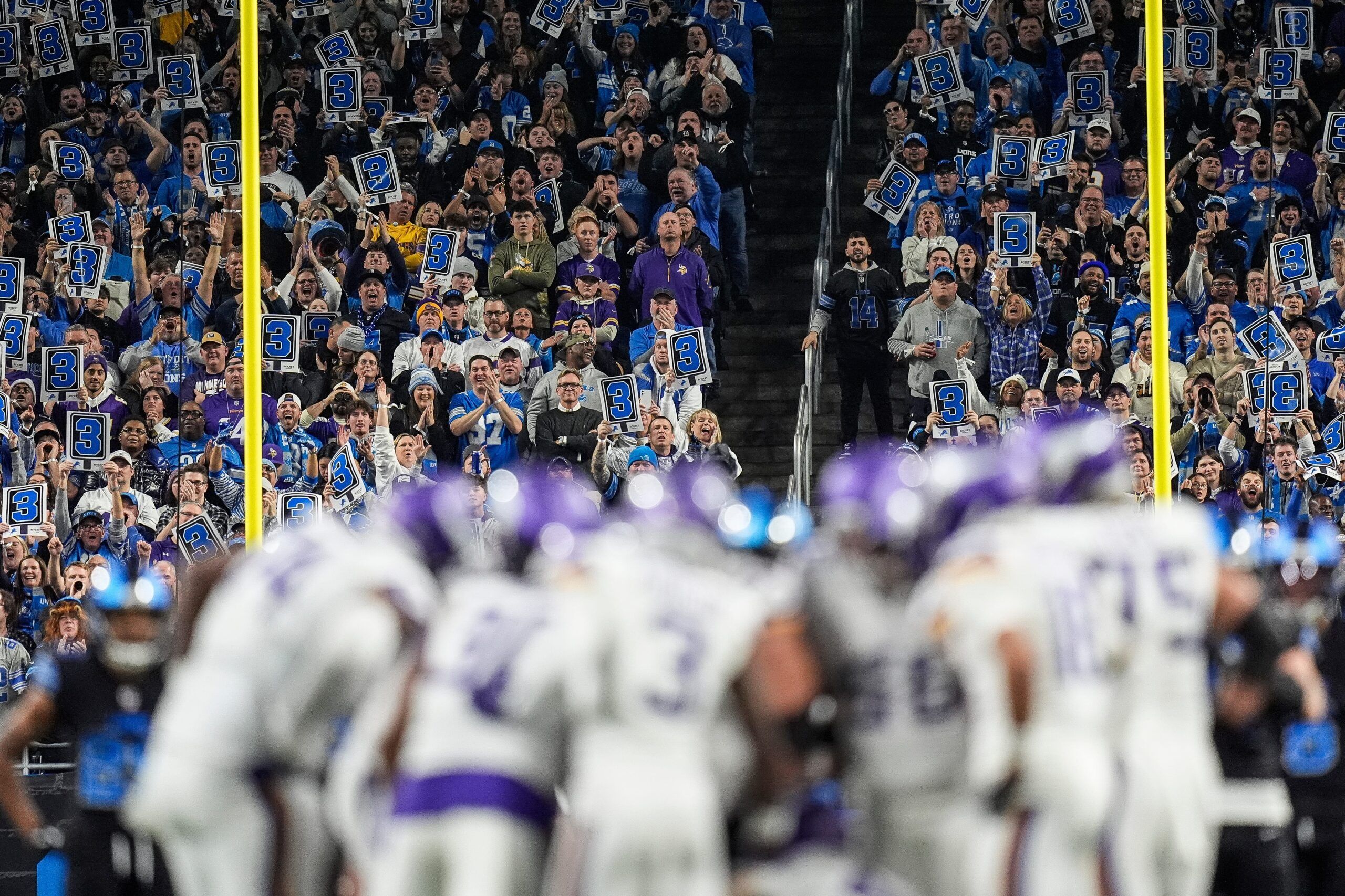 Detroit Lions fans cheer loudly as the Vikings offense lines up for a key third-down play at Ford Field.
