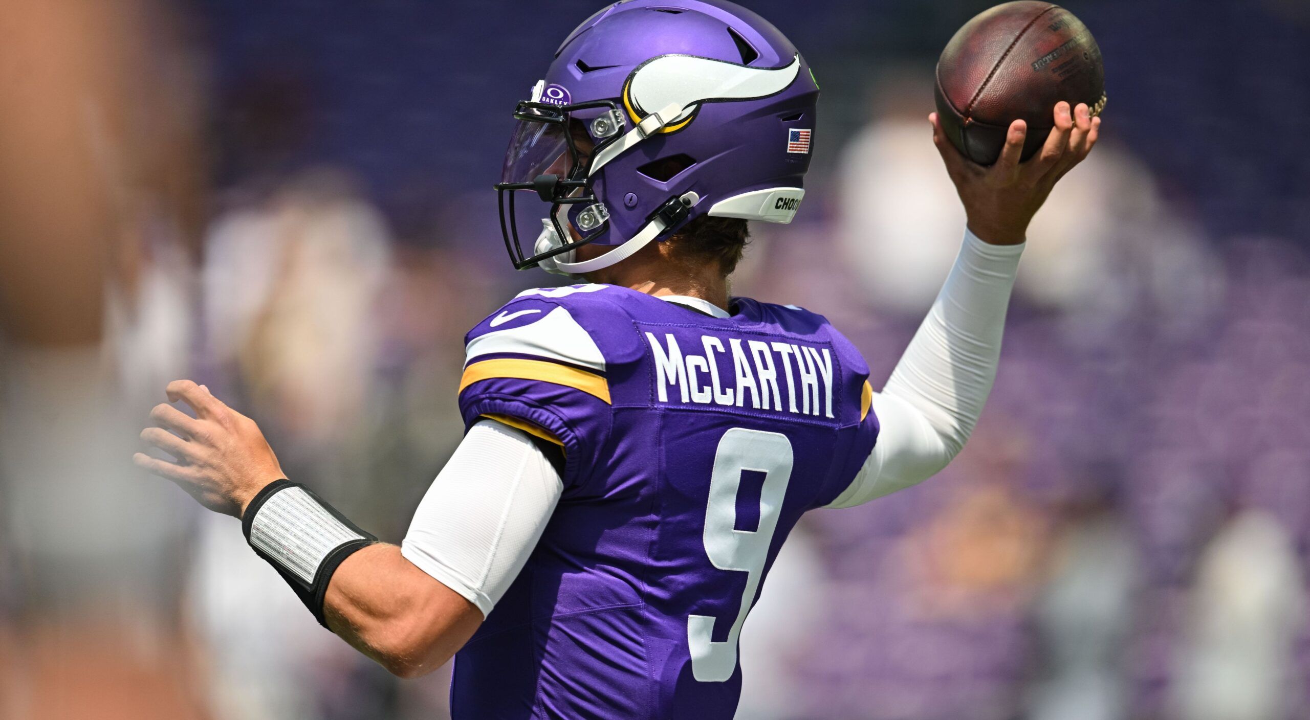 J.J. McCarthy warms up before the Vikings’ preseason game against the Raiders at U.S. Bank Stadium.