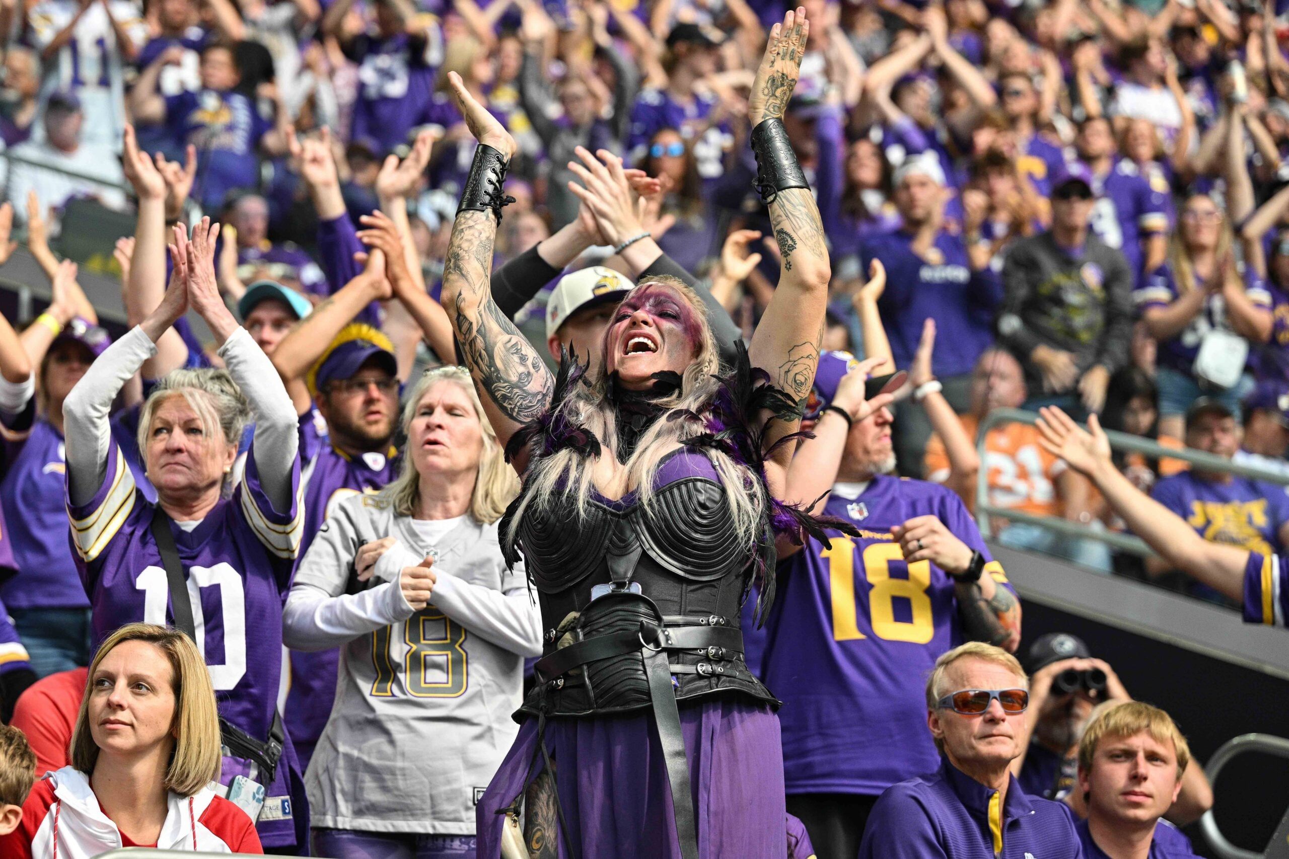 Vikings fans cheer from the stands during the season opener.