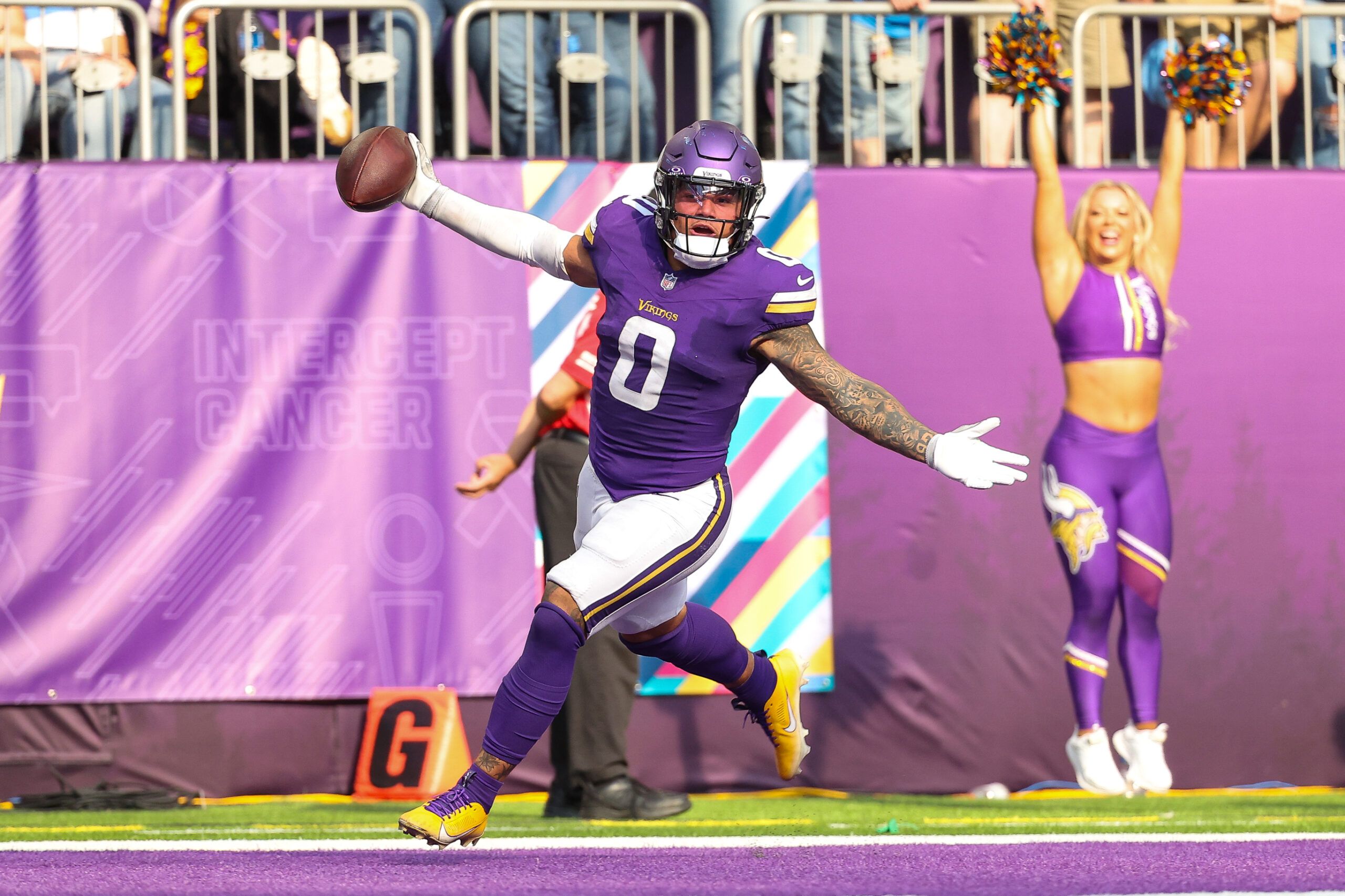 Ivan Pace Jr. celebrates after returning a fumble for a touchdown during a Vikings game against the Detroit Lions.