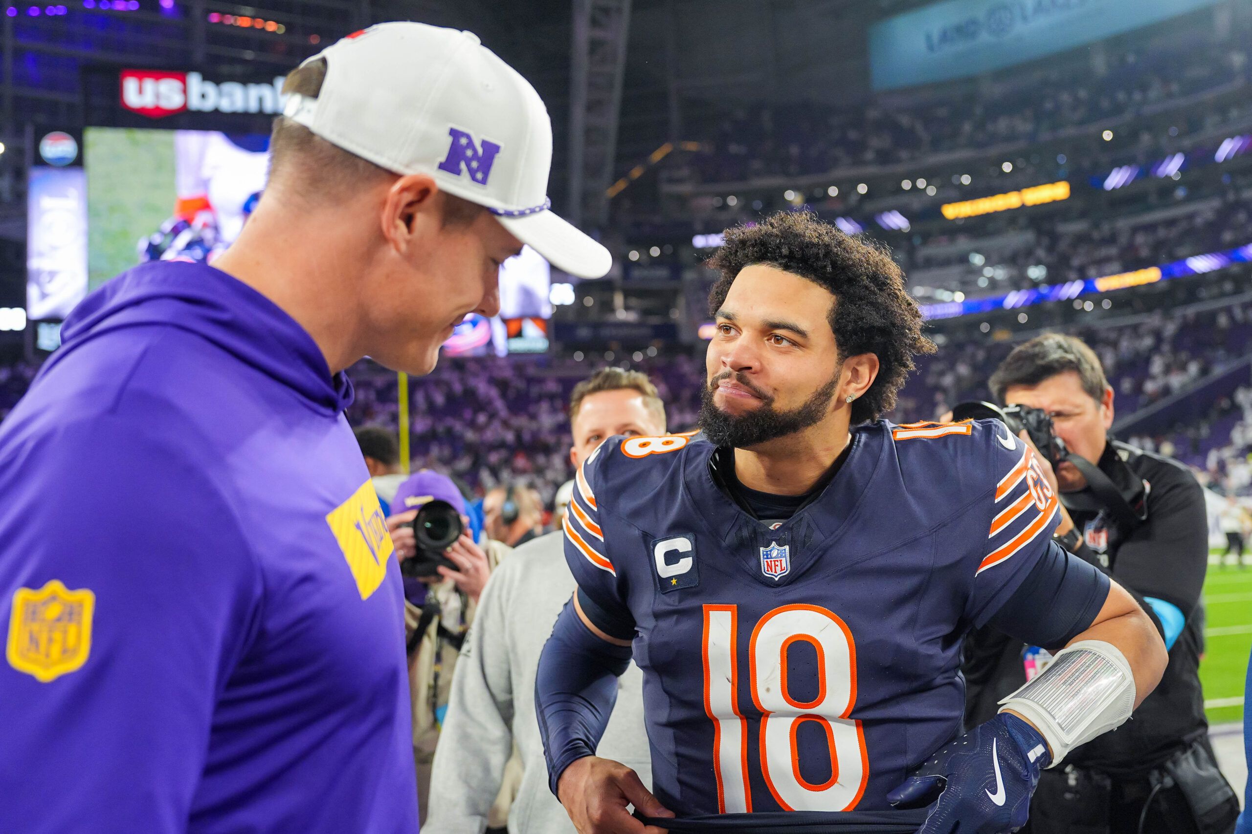 Caleb Williams and Kevin O’Connell talk after the game at U.S. Bank Stadium.