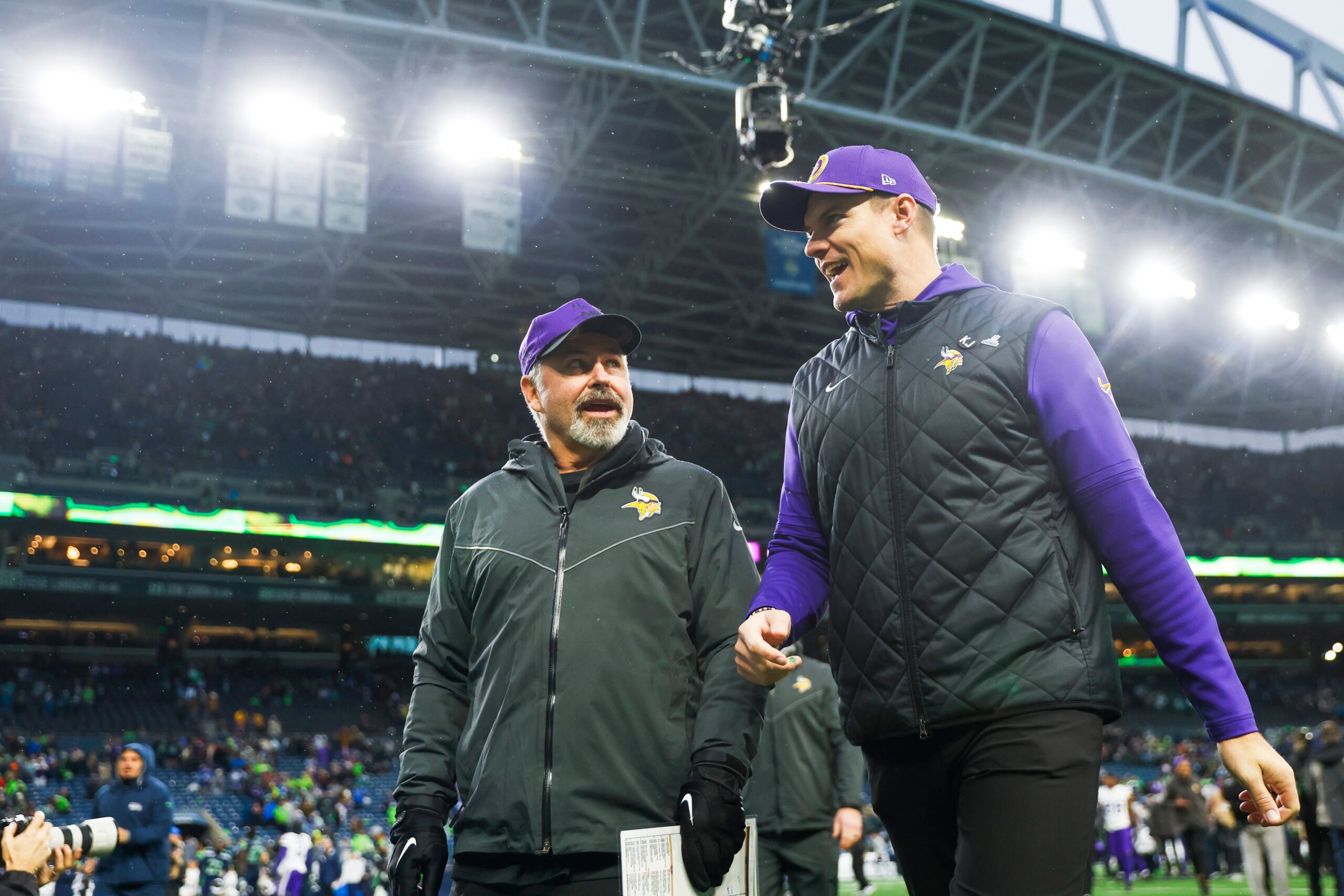 Kevin O’Connell and Mike Pettine walk to the locker room after a win over the Seahawks.