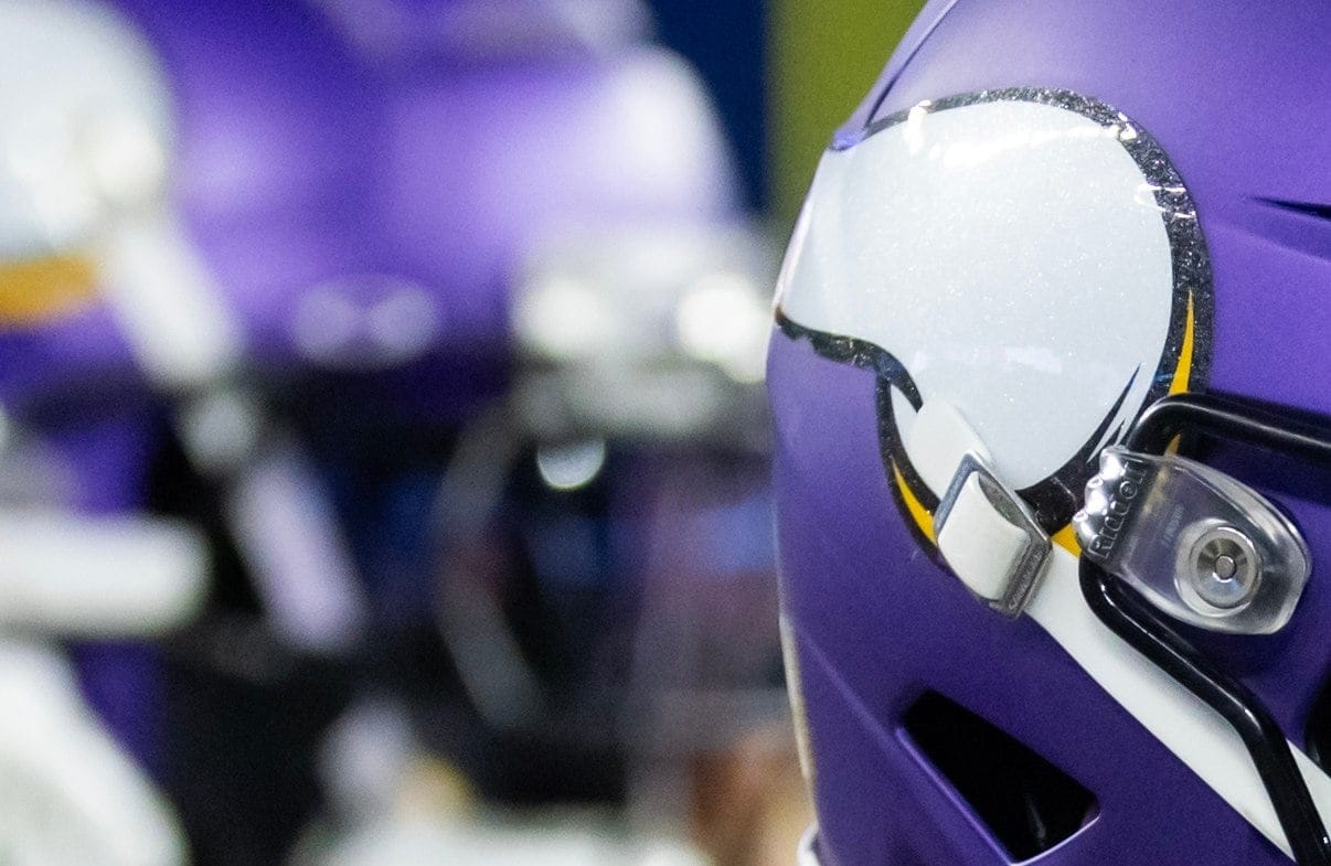 Vikings safety running onto the field during a playoff game against the Rams.