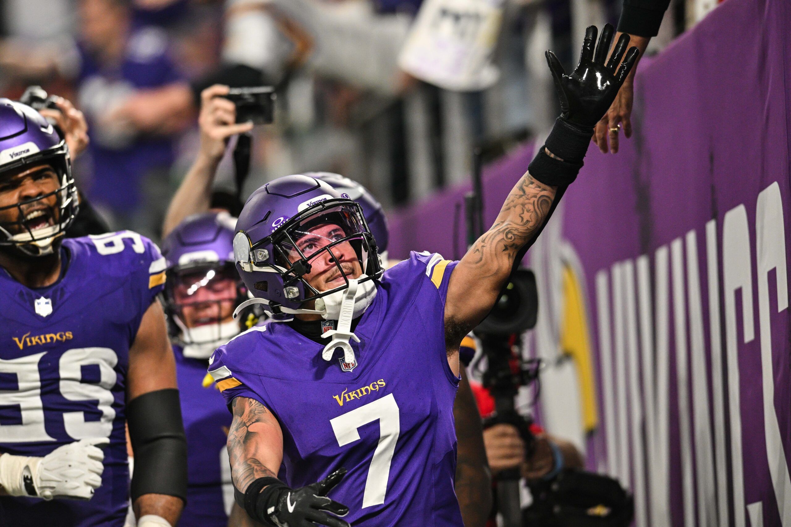 Byron Murphy Jr. reacts with fans after intercepting Joe Flacco against the Colts in 2024.
