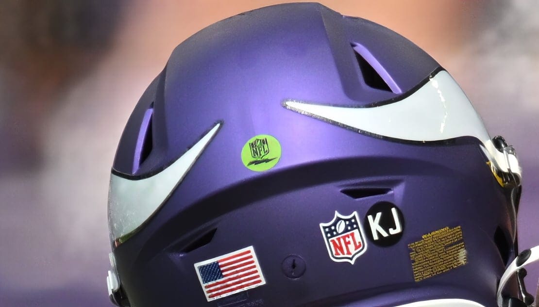 J.J. McCarthy and Kevin O’Connell talk before a preseason game in Minneapolis.