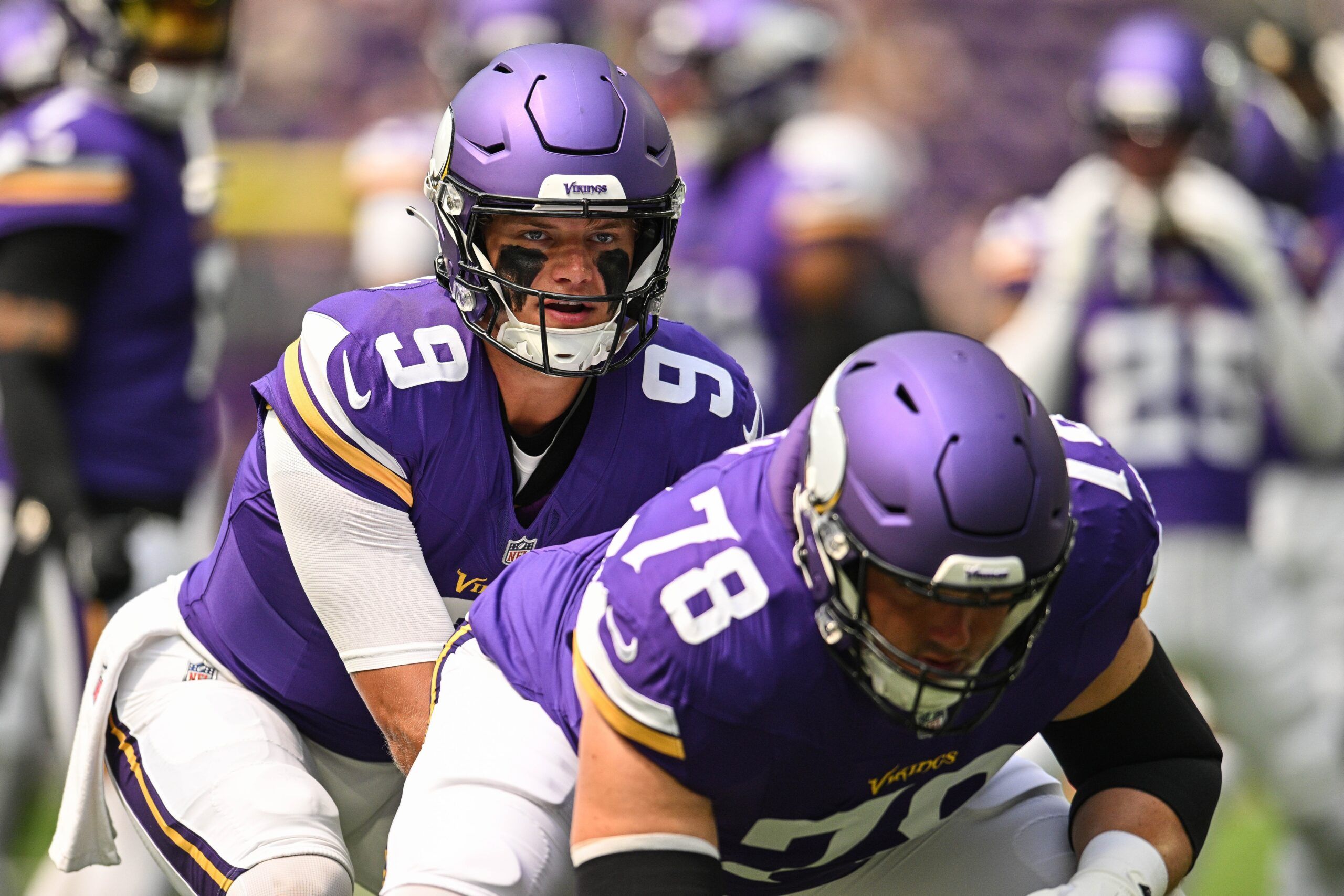 J.J. McCarthy and Ryan Kelly warm up before the Vikings’ preseason game against the Texans in Minneapolis.