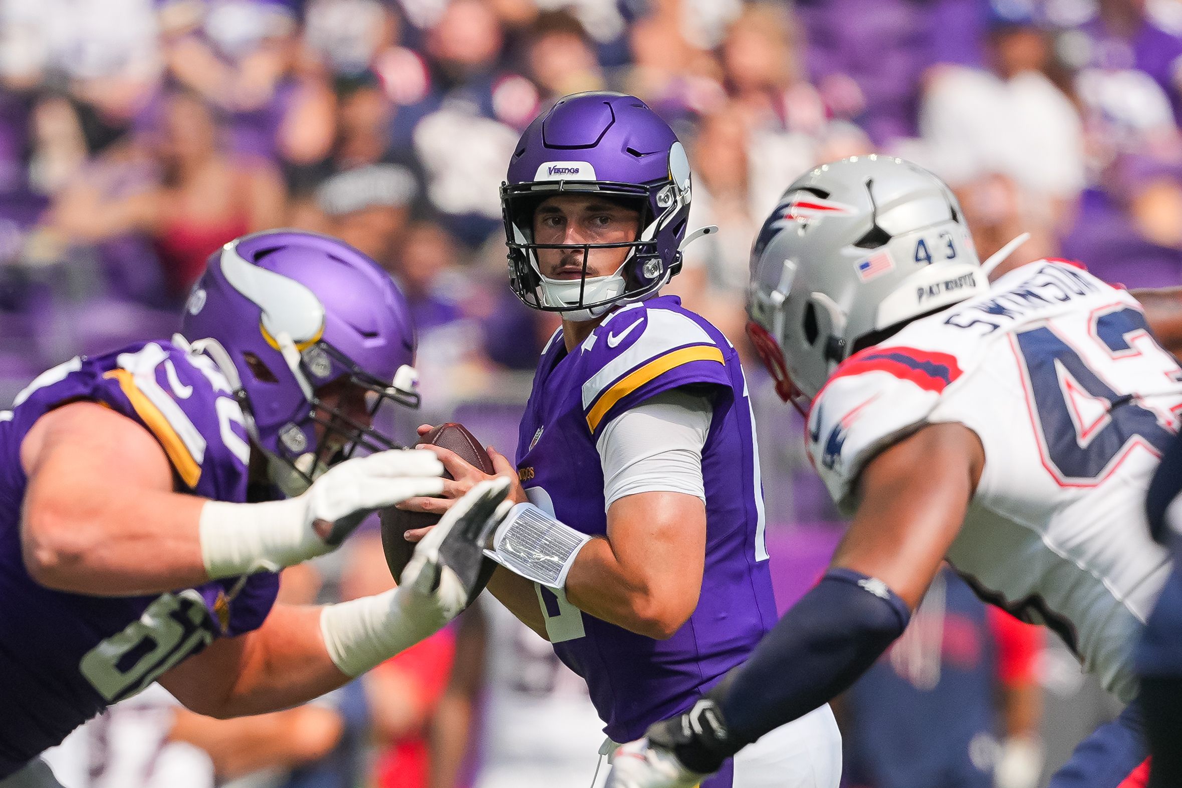 Vikings quarterback Max Brosmer drops back to pass against the Patriots in 2025 preseason.