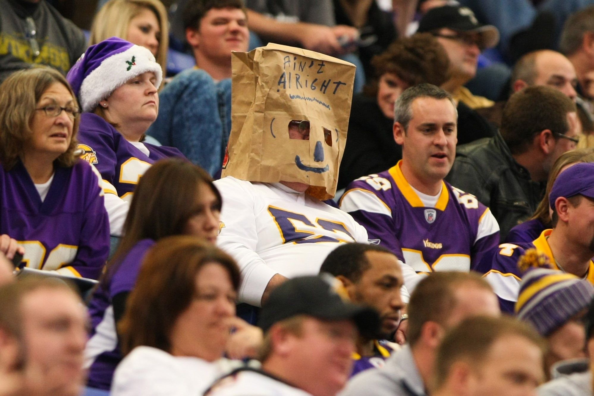 Vikings fan wears a bag over his head during a game against the Saints