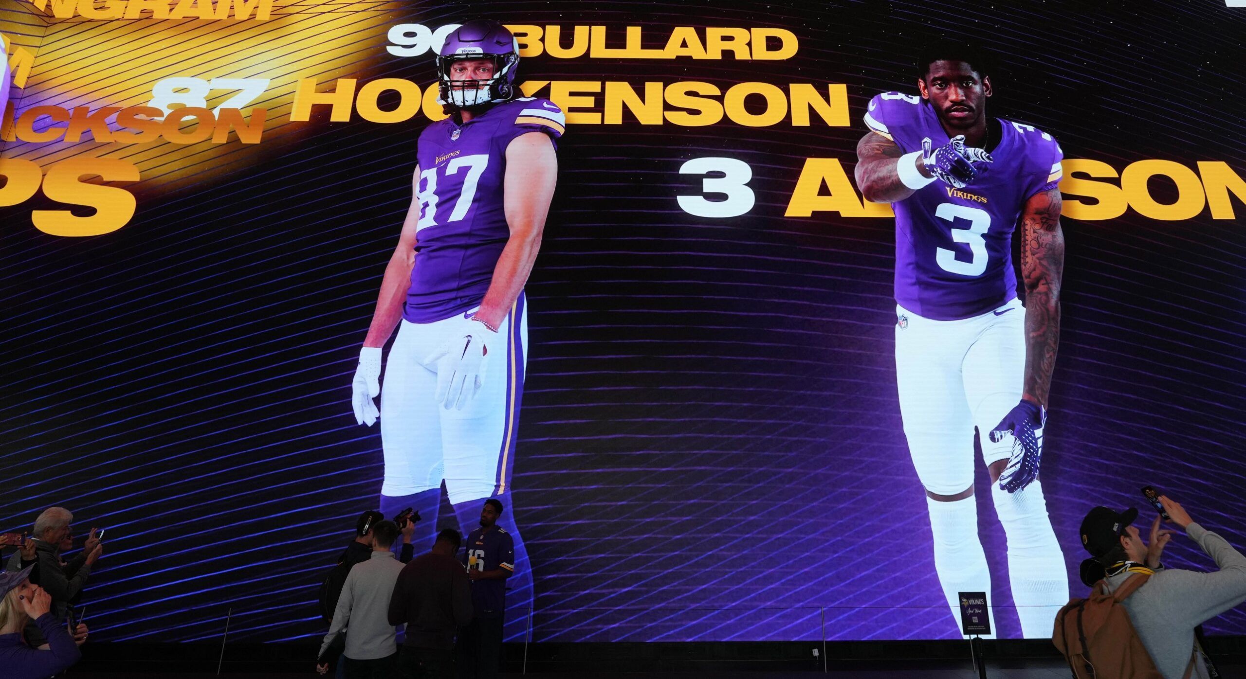 Images of Minnesota Vikings players T.J. Hockenson, Jordan Addison, and Ivan Pace Jr. projected on the walls during the team’s immersive experience at Outernet London before the 2024 International Series game against the New York Jets.