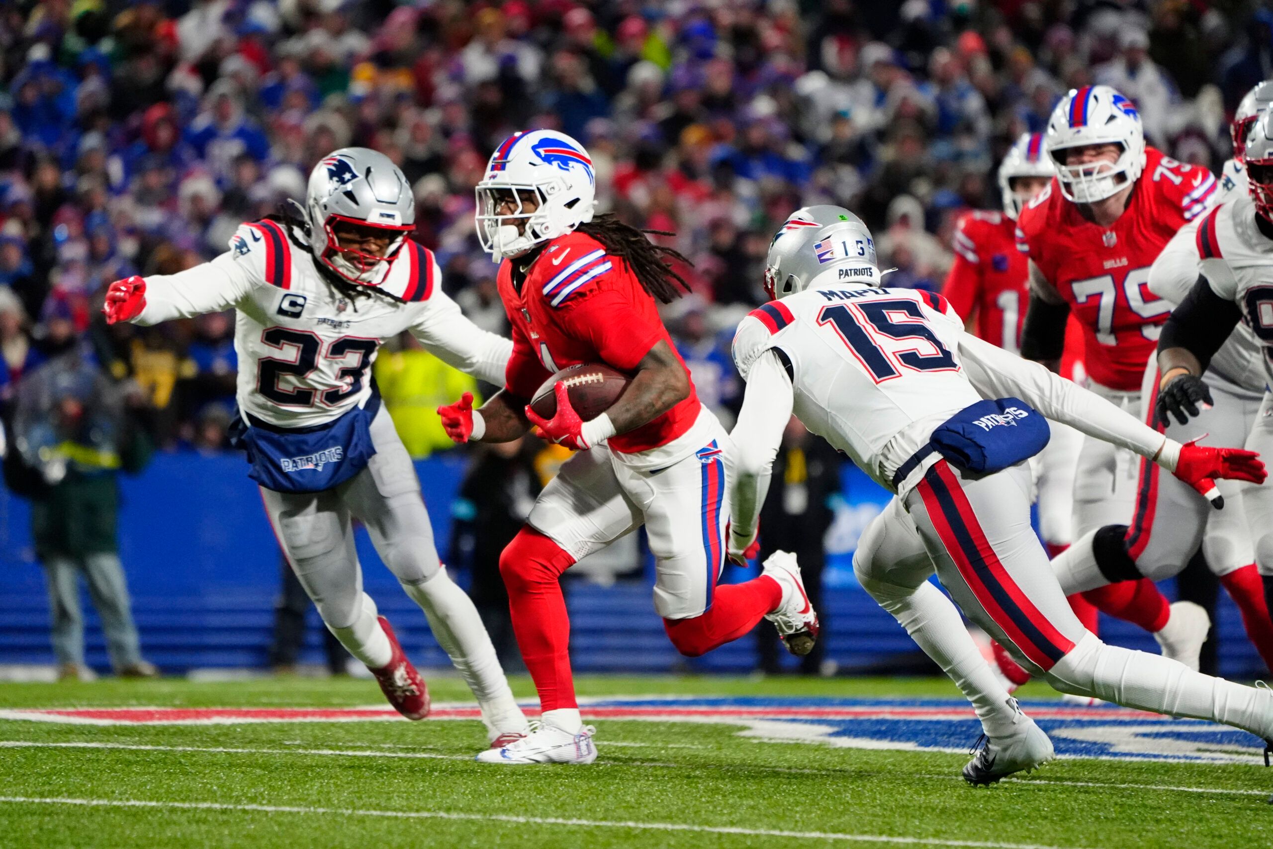 Patriots safety Kyle Dugger pursues Bills RB James Cook.