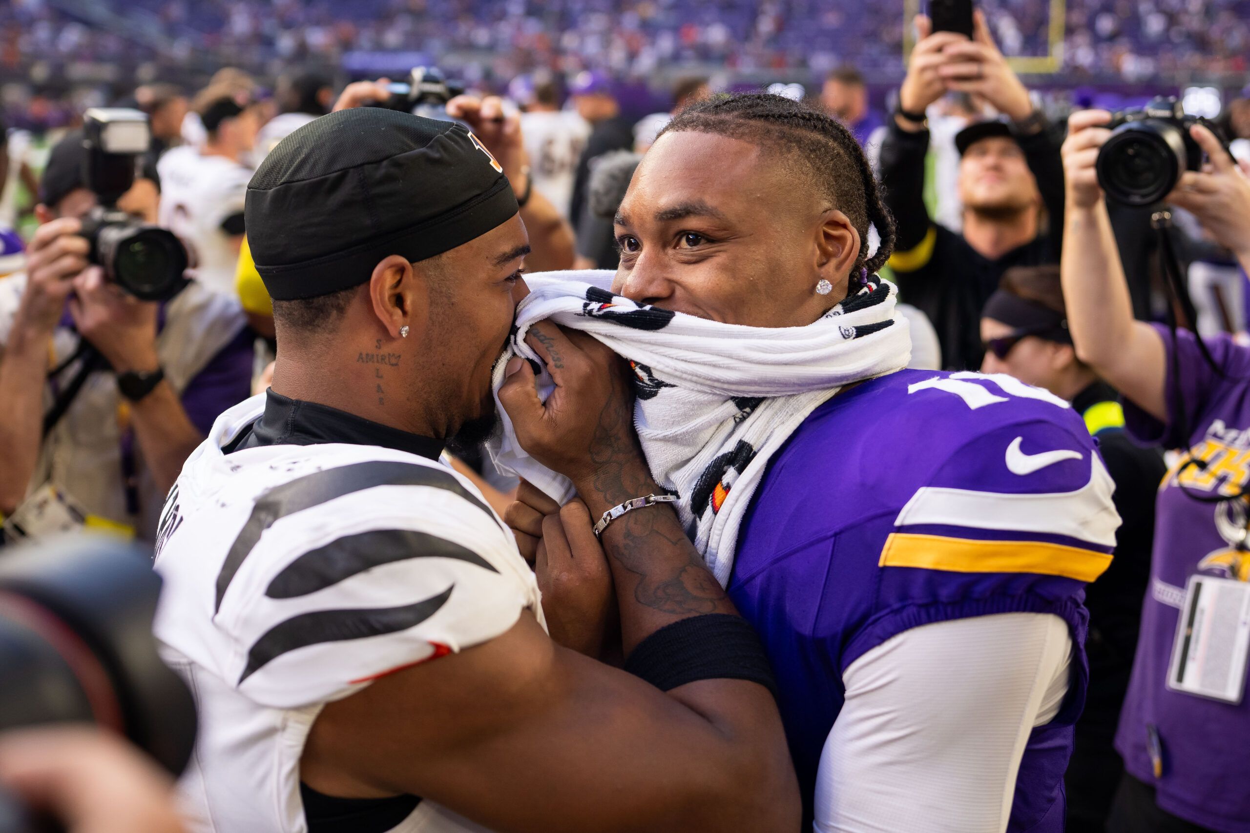 Ja’Marr Chase and Justin Jefferson hug after a game at U.S. Bank Stadium.