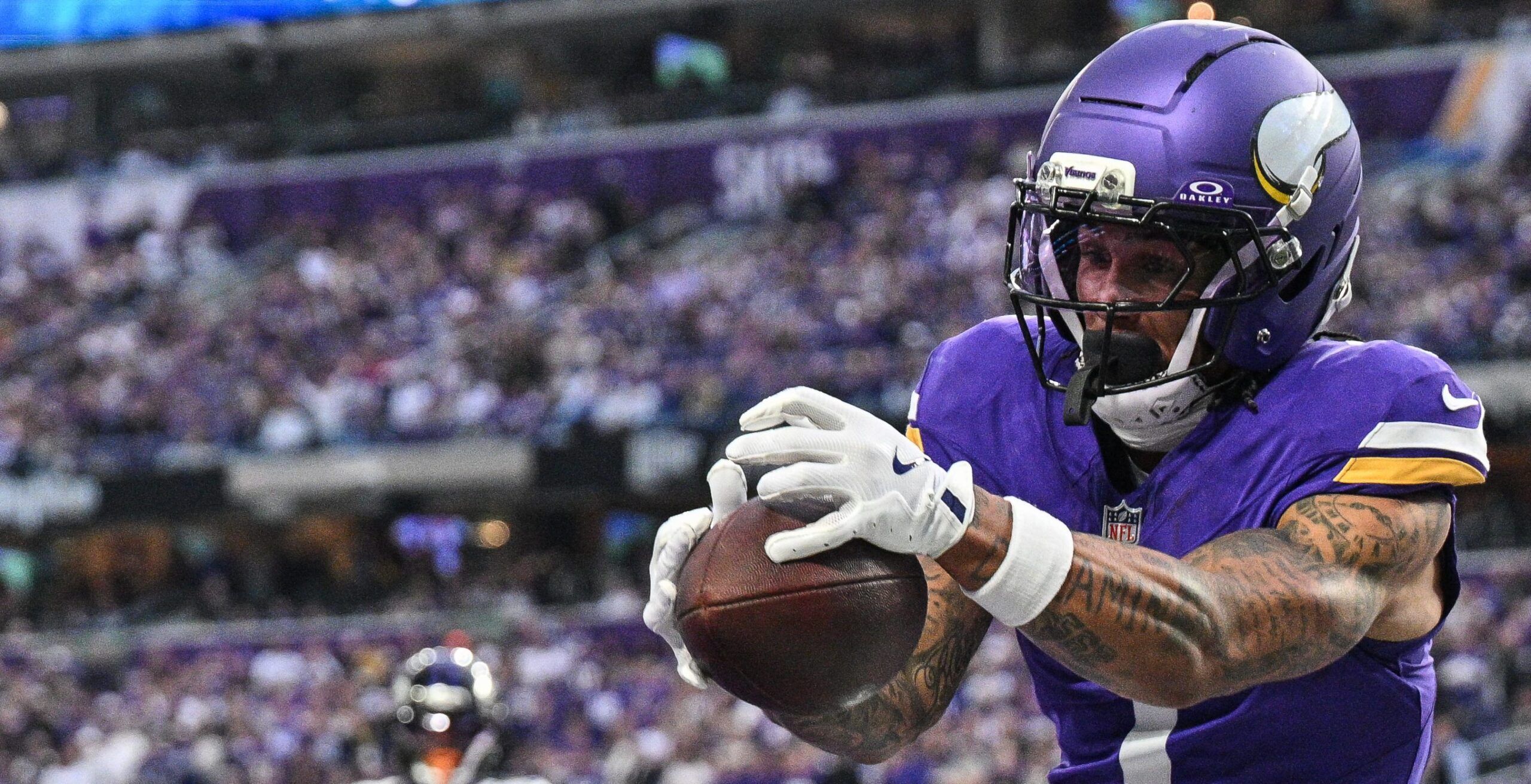 Jalen Nailor catches a touchdown while defended by Nate Wiggins during the Vikings’ game against the Ravens.