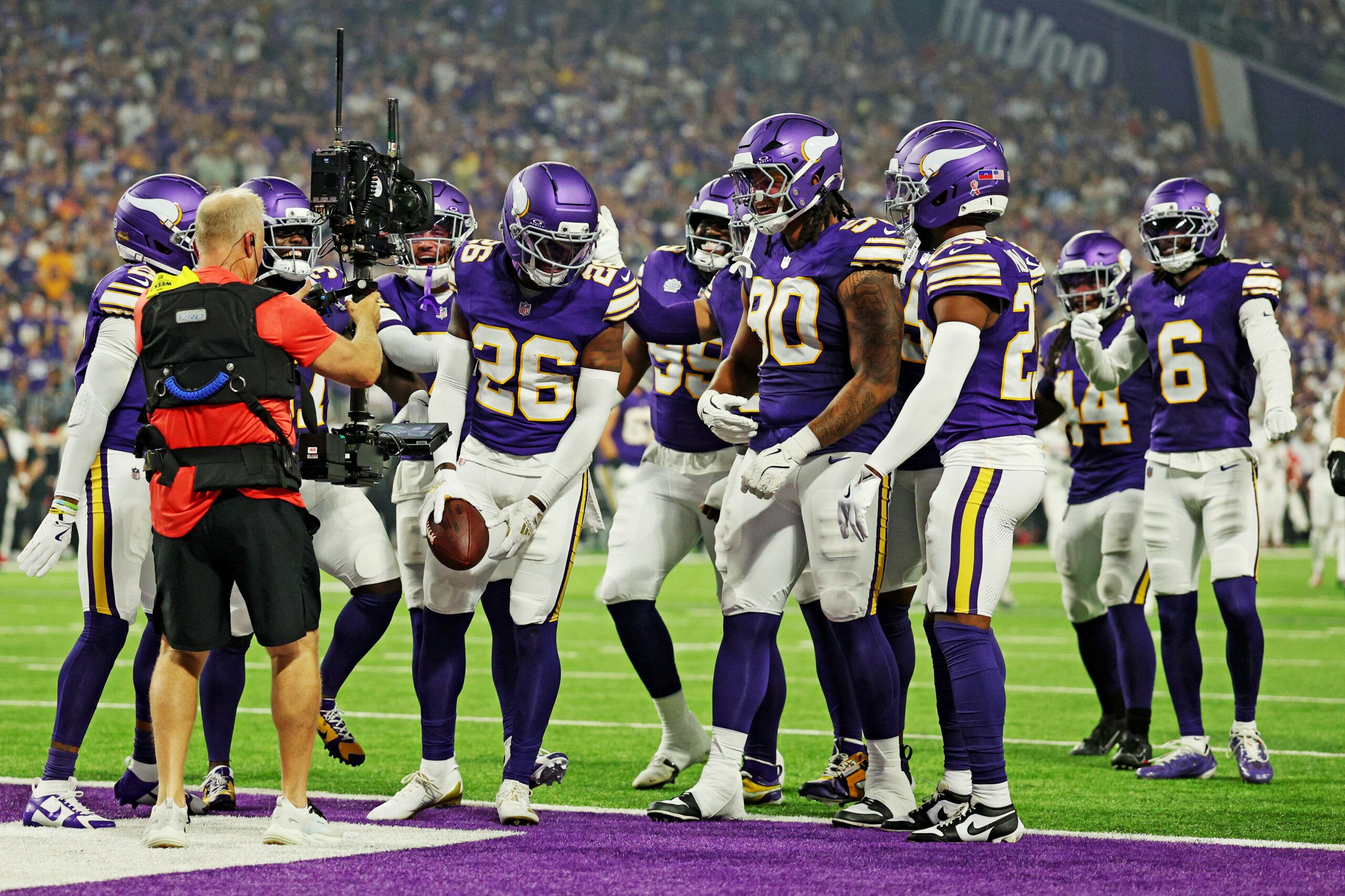 Vikings safety Theo Jackson celebrates with teammates in 2025.