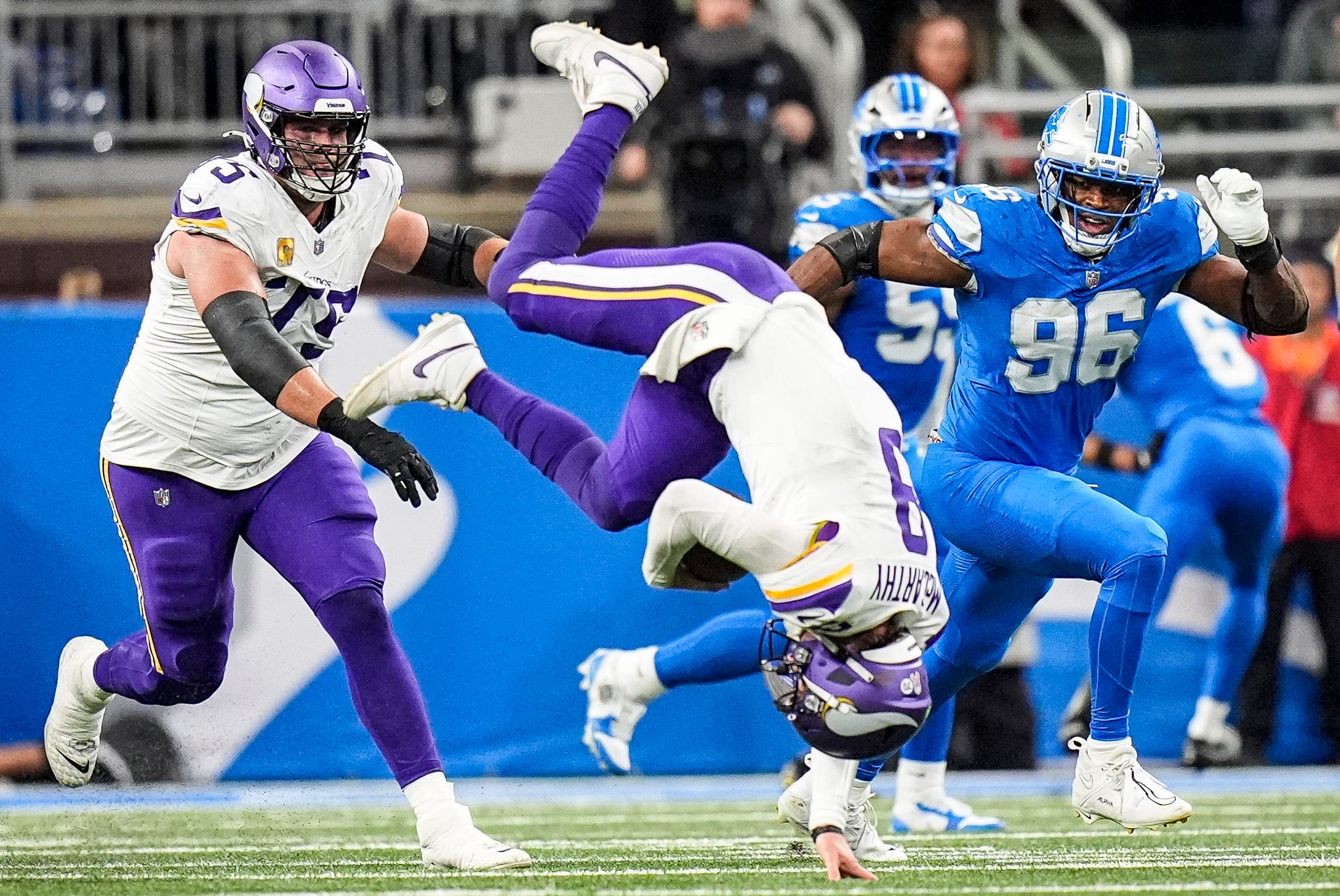 Vikings QB J.J. McCarthy does a somersault in Detroit.
