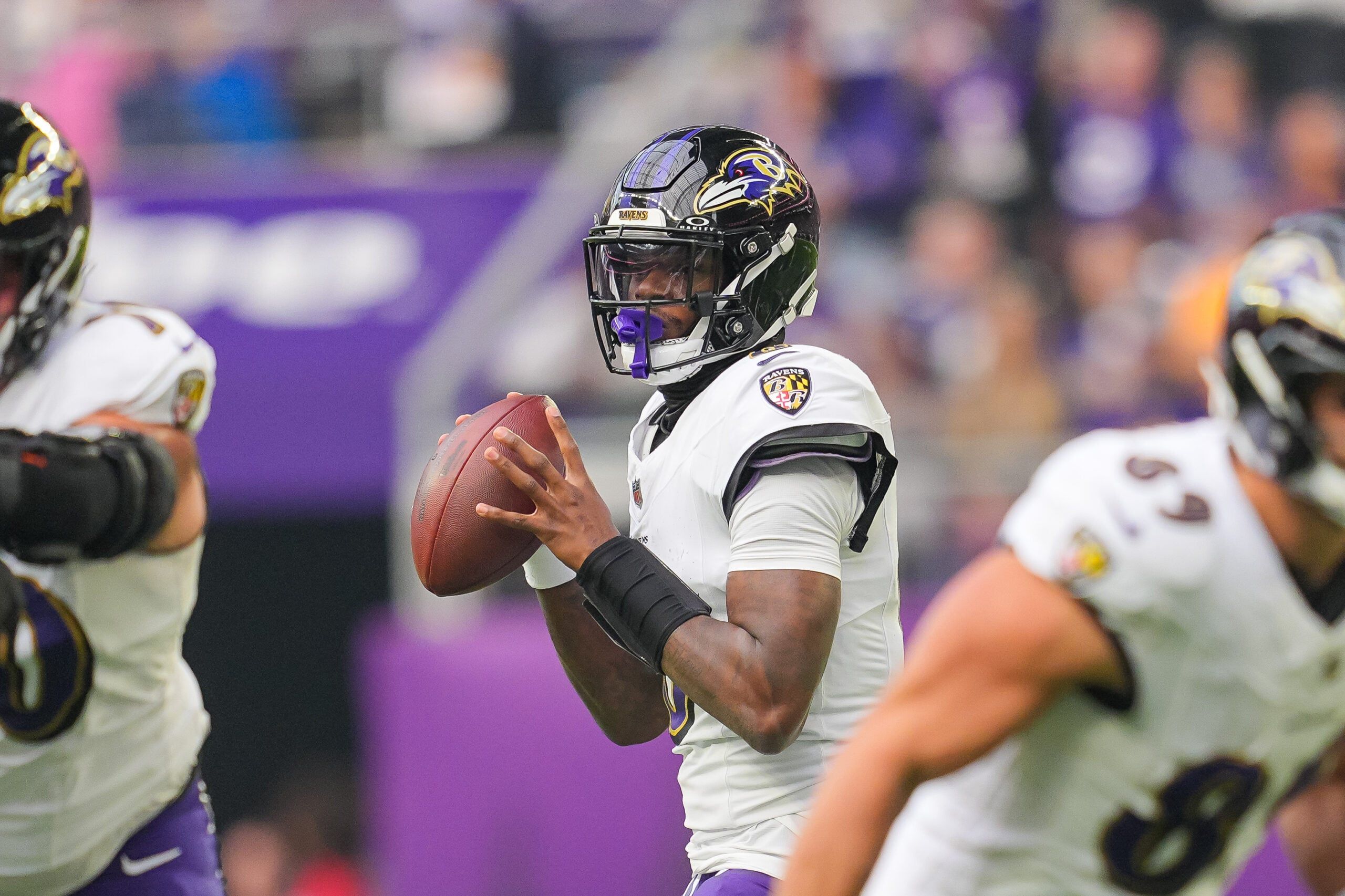 Lamar Jackson drops back to pass against the Vikings at U.S. Bank Stadium.