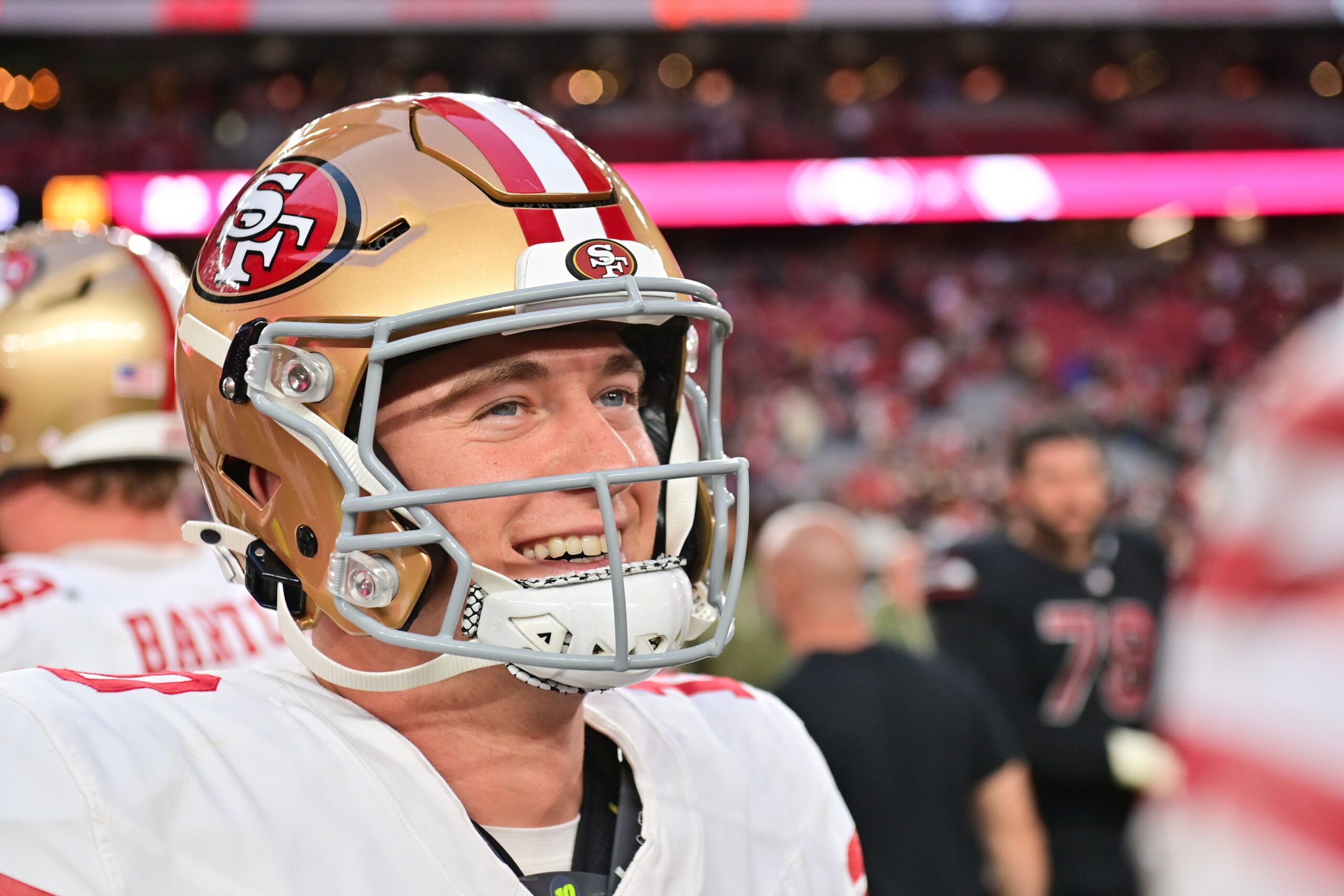 Mac Jones looks on after a 49ers win over the Cardinals.