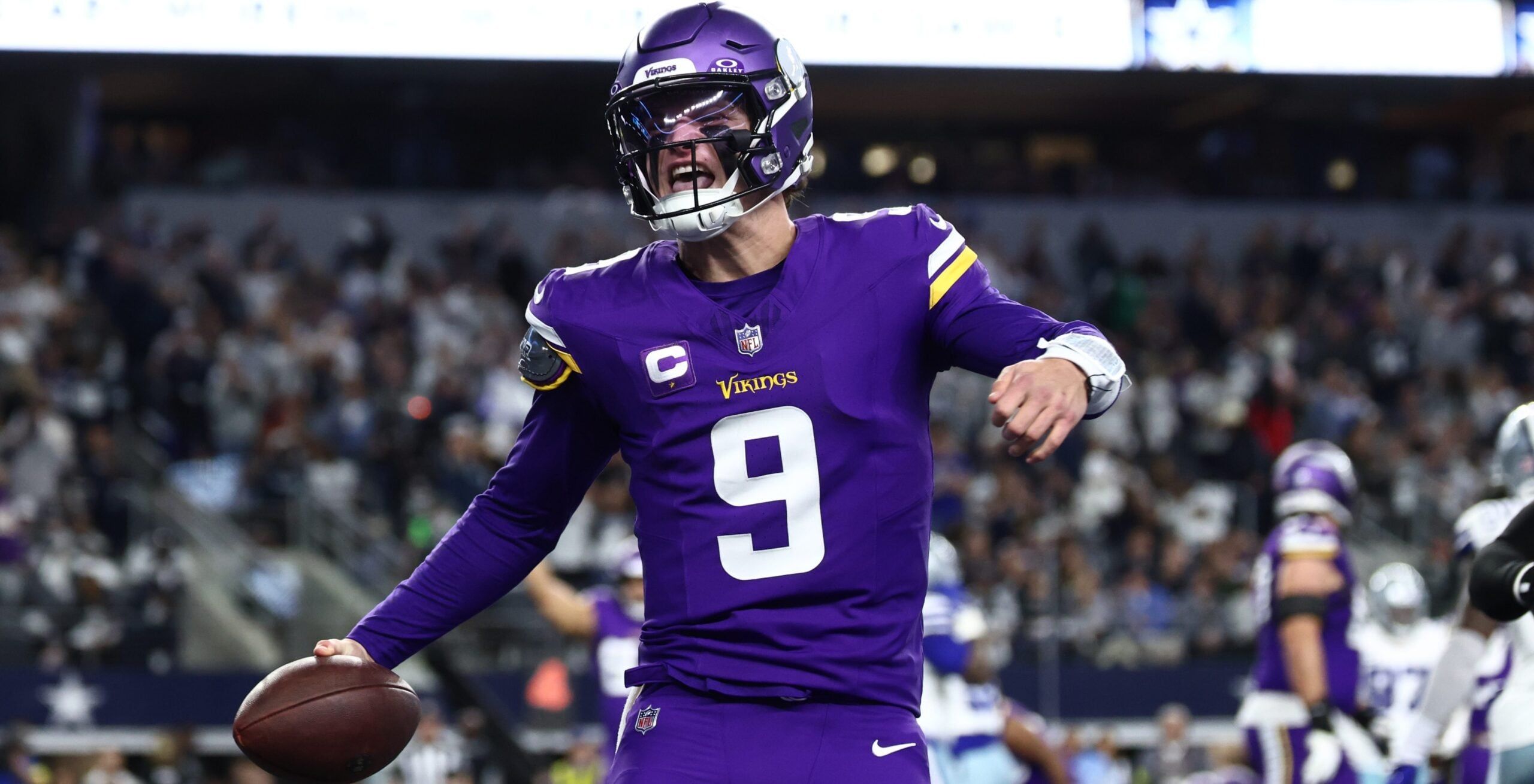J.J. McCarthy celebrating a touchdown during a Vikings game against the Cowboys at AT&T Stadium