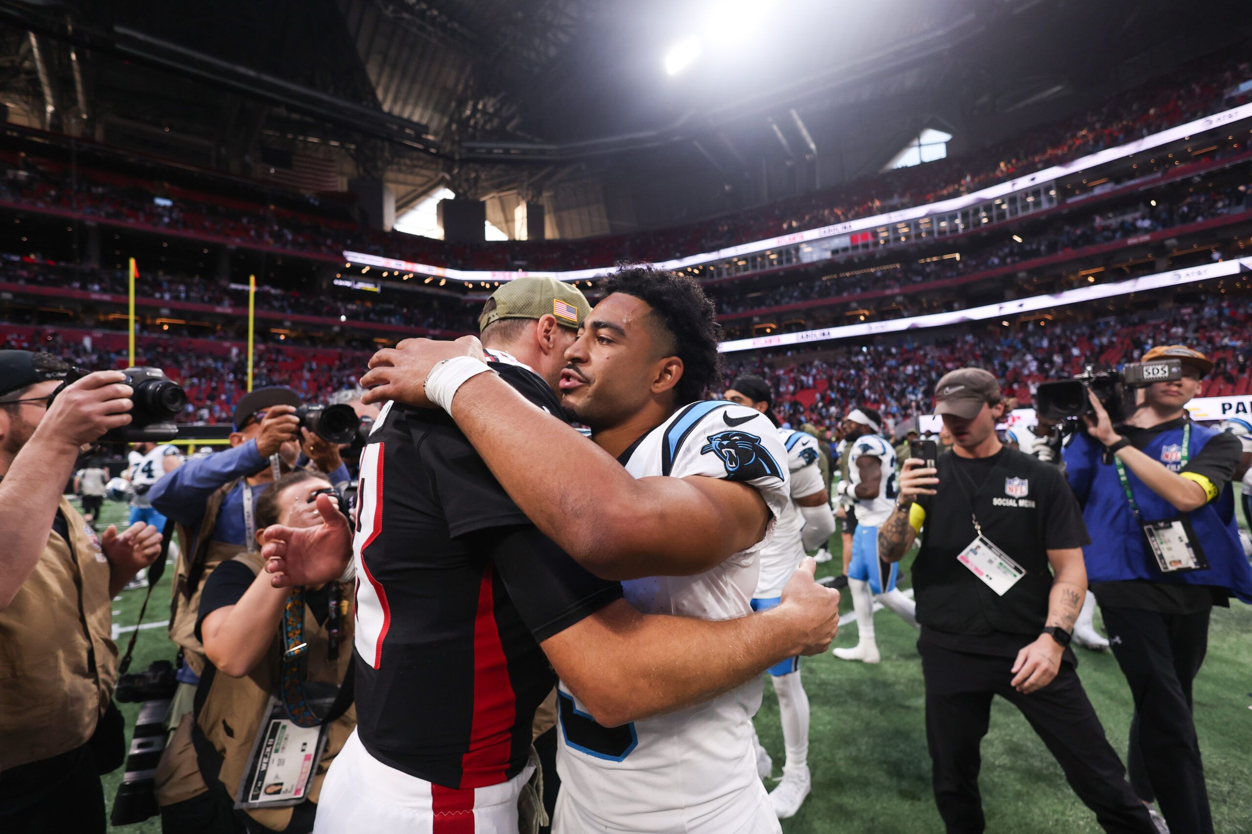 Kirk Cousins and Bryce Young in 2025 after the game.