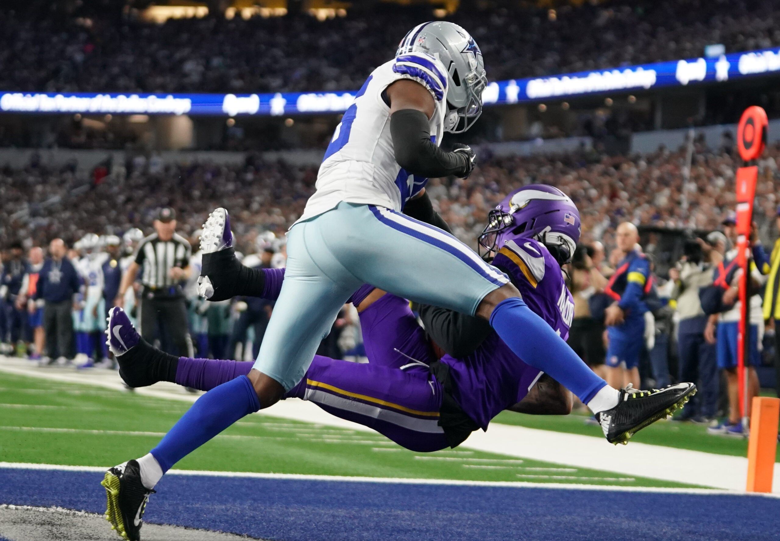 Jalen Nailor catches a touchdown pass over Cowboys cornerback Daron Bland during the first half at AT&T Stadium.