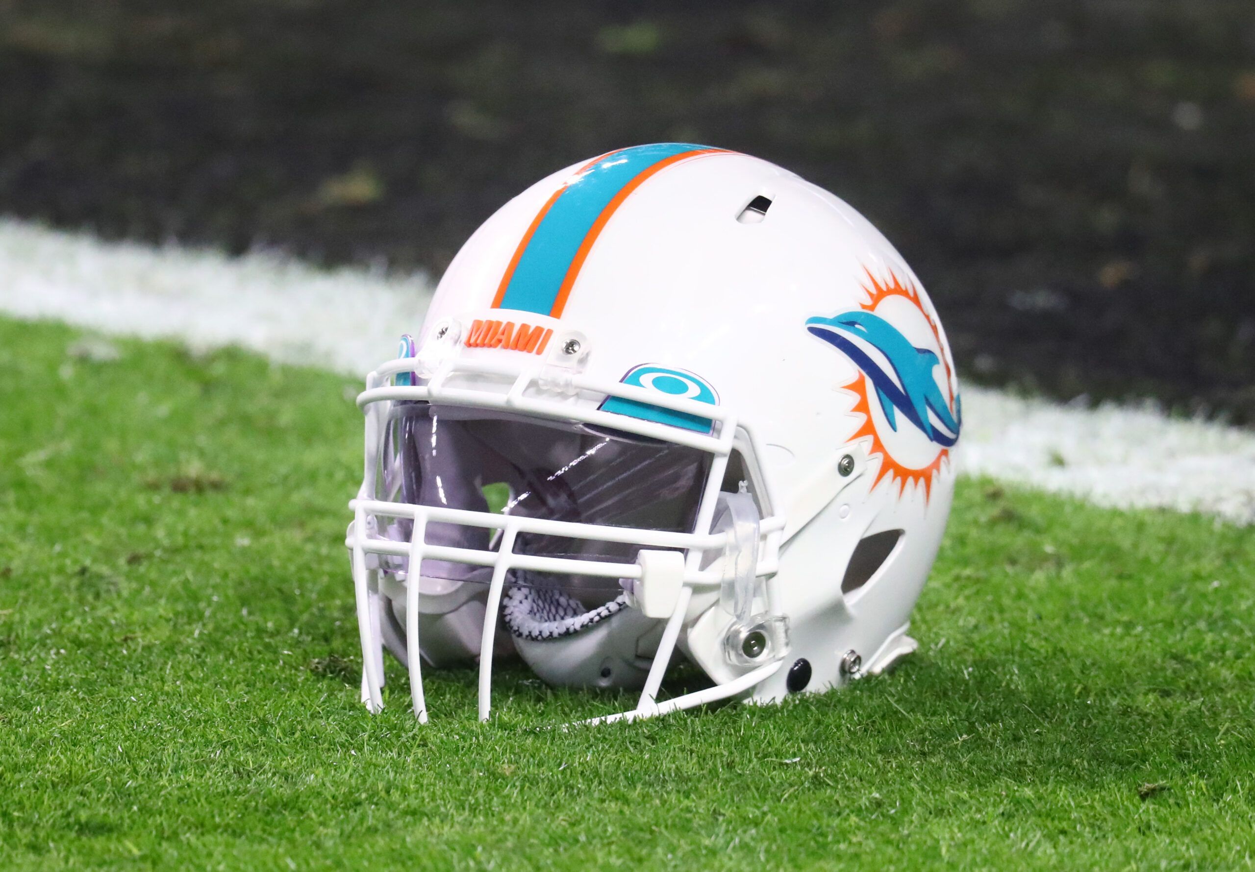 Miami Dolphins helmet on the field in 2020 before a Raiders game