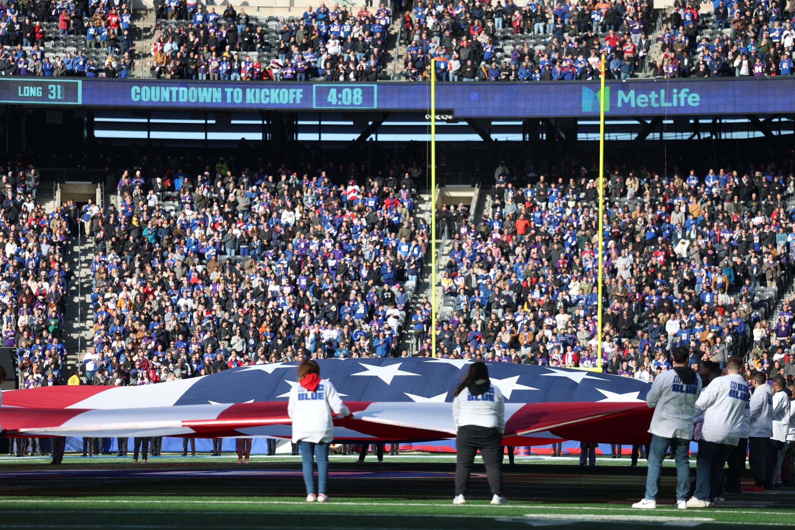 Fans at Giants-Vikings game and flag in 2025