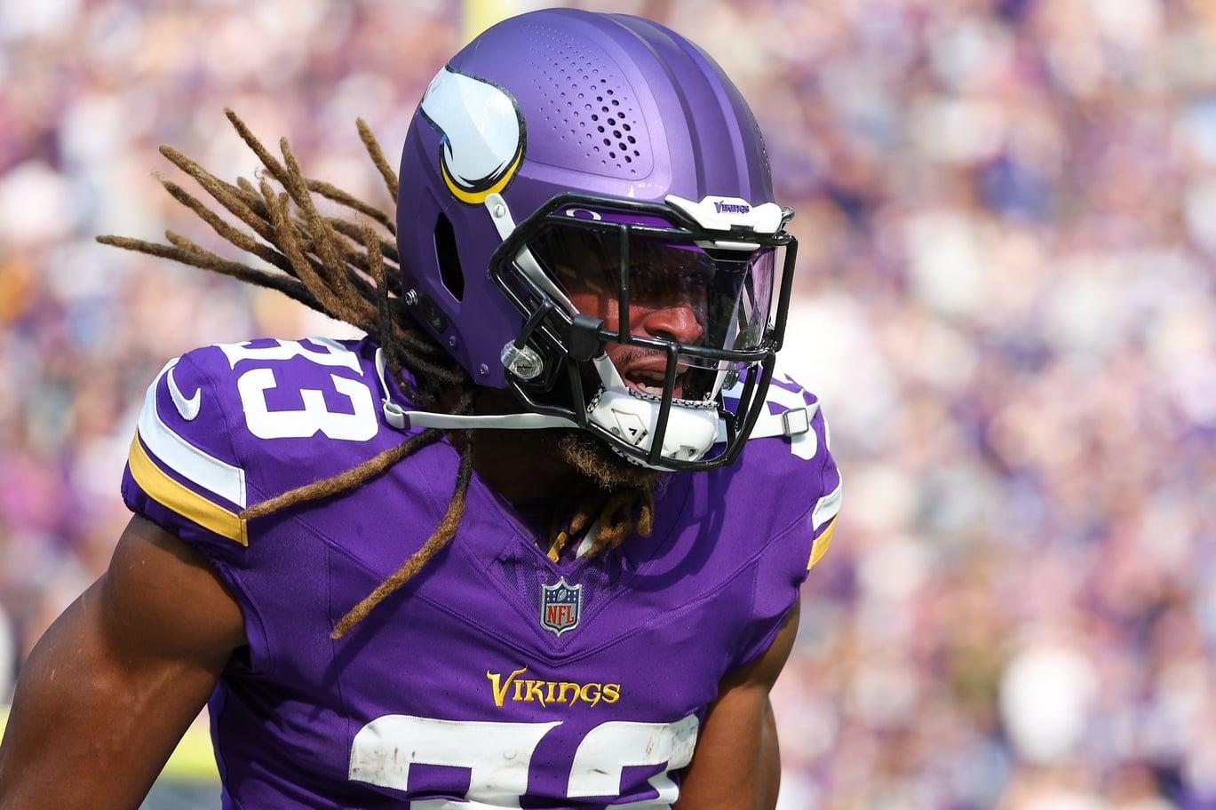 Aaron Jones celebrates after scoring a touchdown against the Lions at U.S. Bank Stadium.