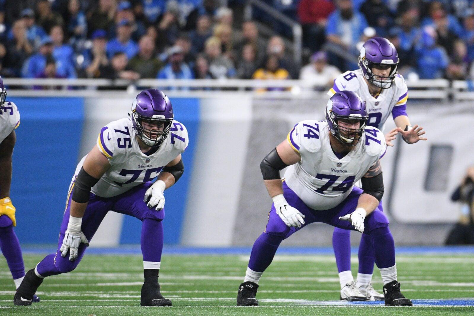 Brian O’Neill and Mike Remmers play for the Vikings against the Lions.